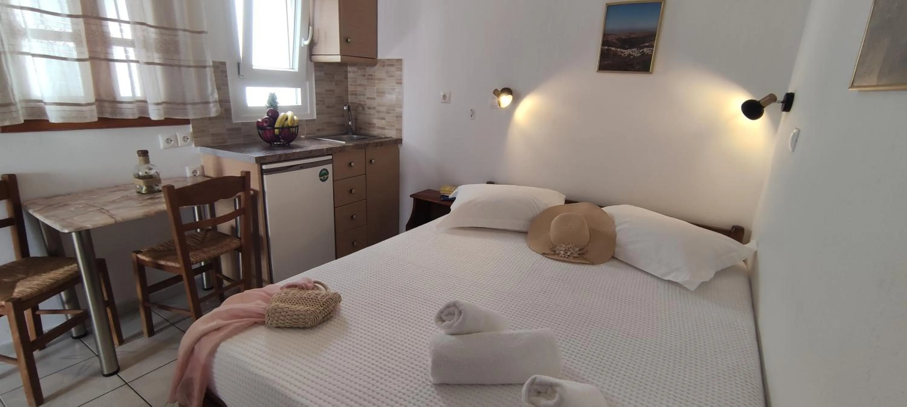 Bed in Kapetanos Rooms