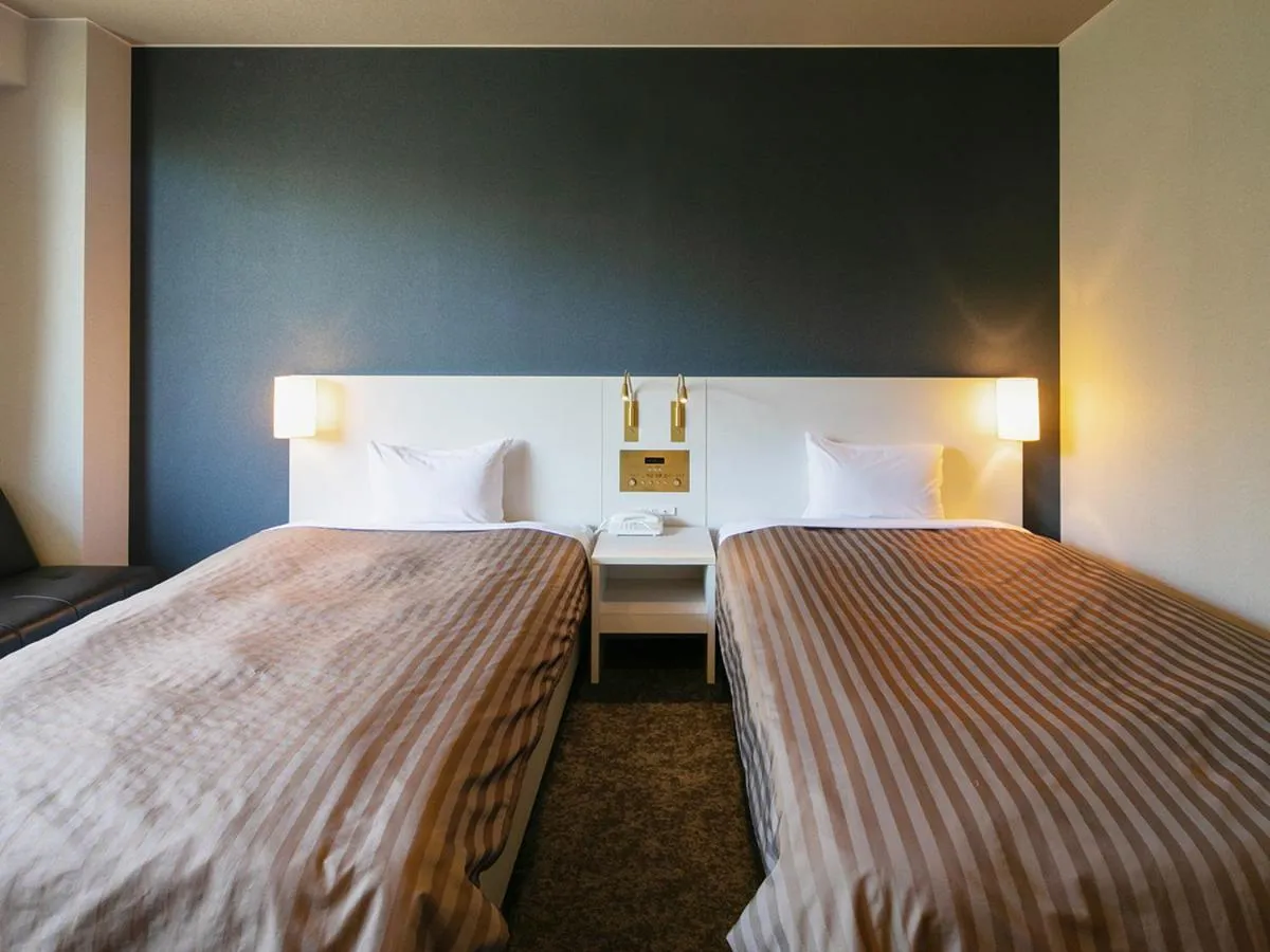 Bed in Itoen Hotel Kusatsu