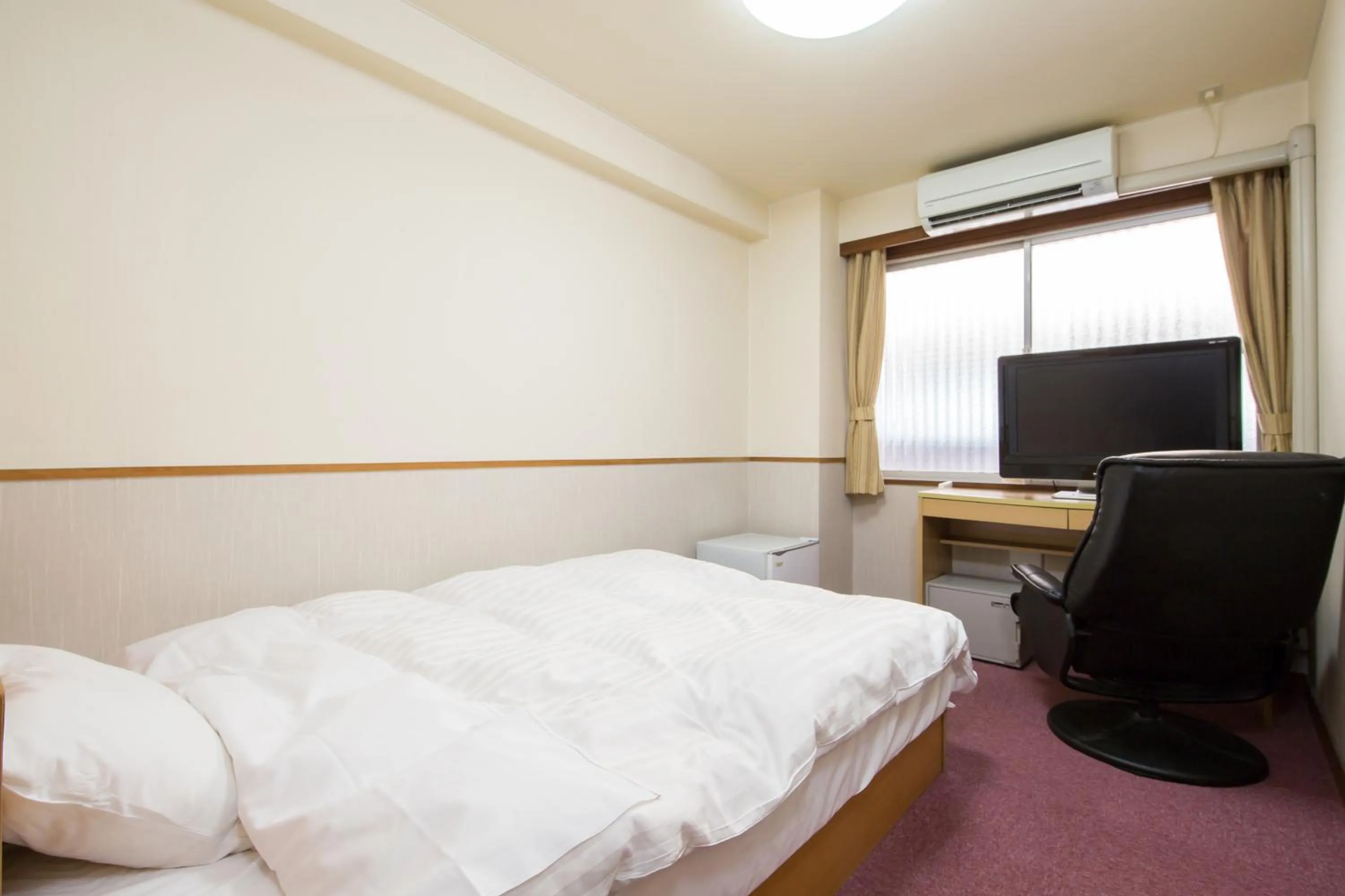 Bed in Itoen Hotel Asamanoyu