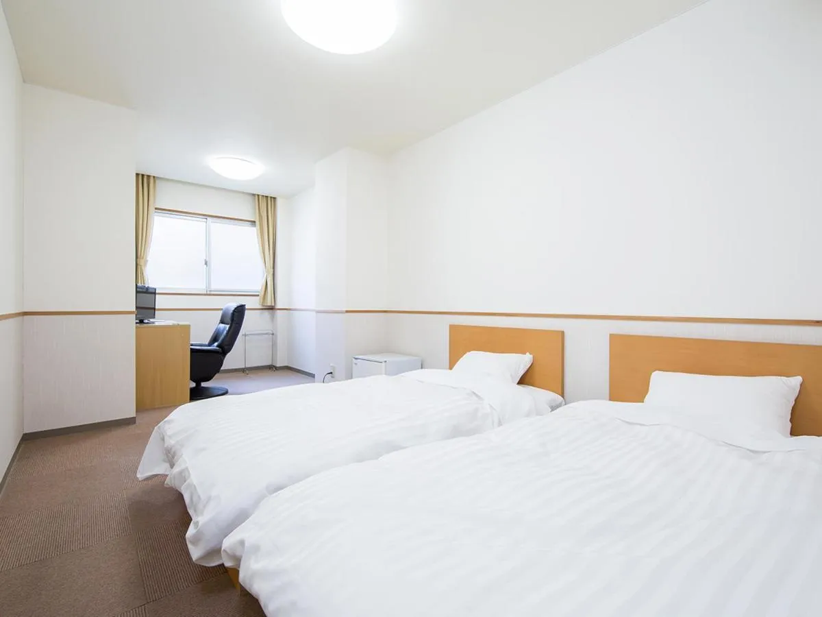 Bed in Itoen Hotel Asamanoyu