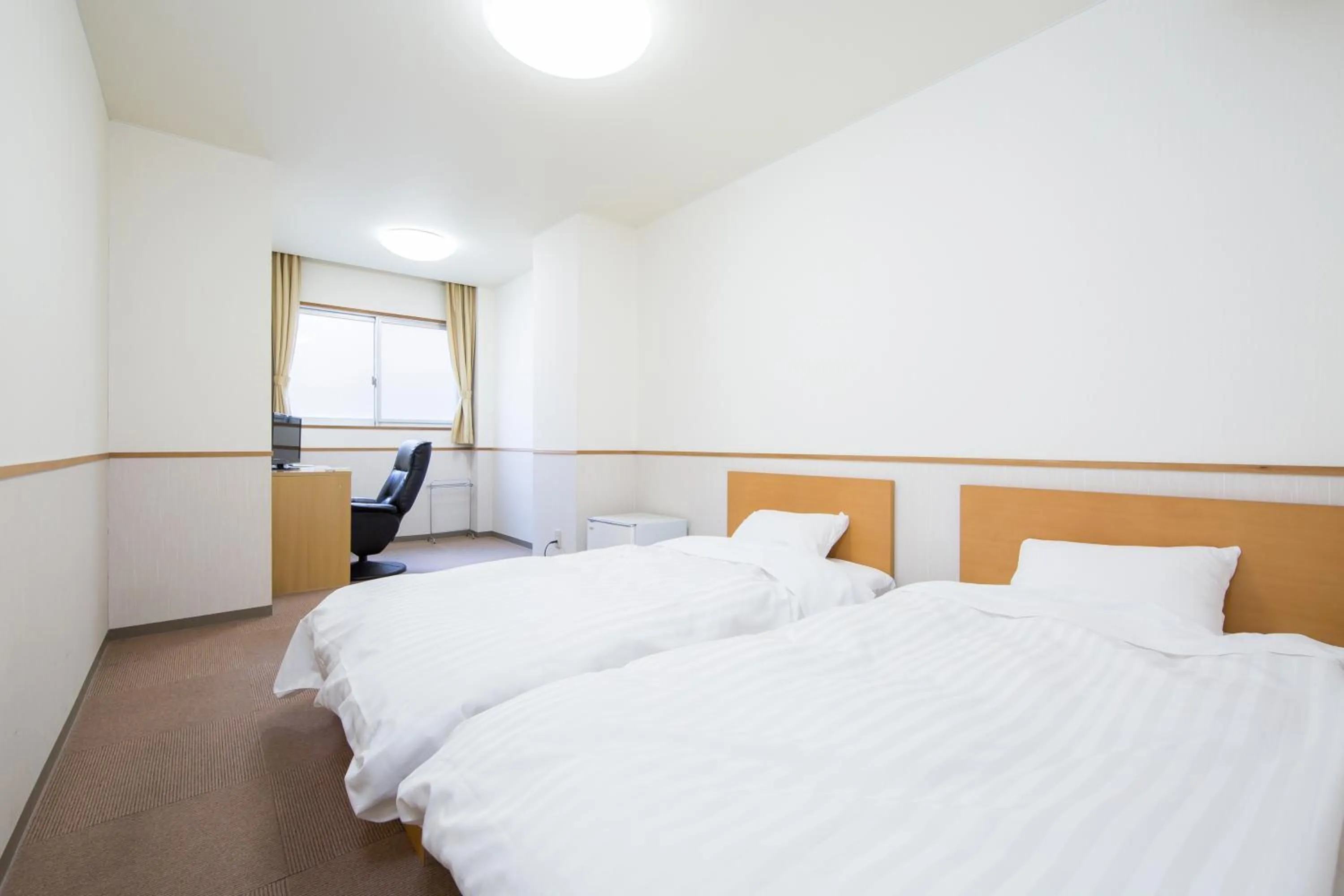 Bed in Itoen Hotel Asamanoyu