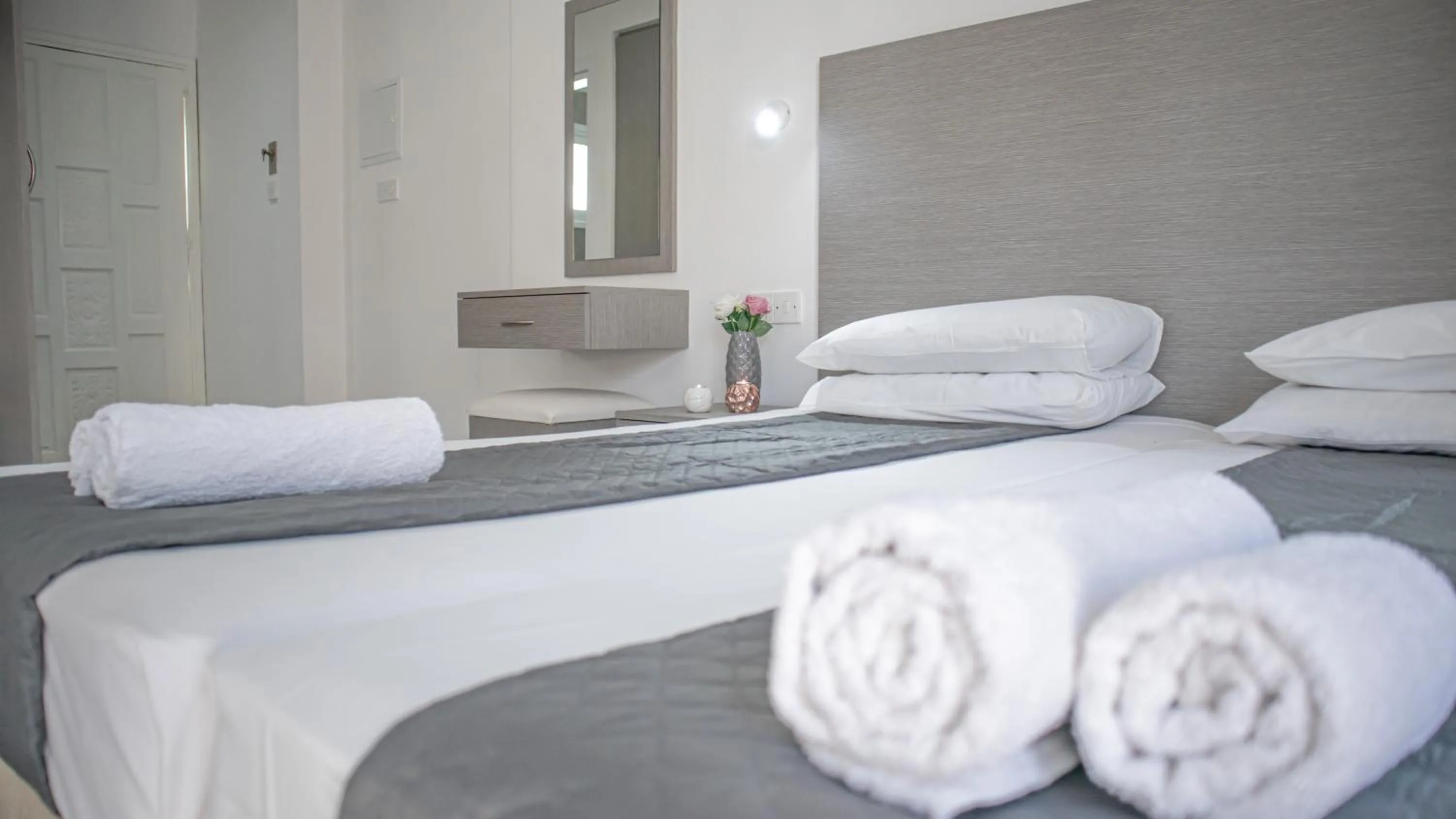 Bed in Windmills Hotel Apartments