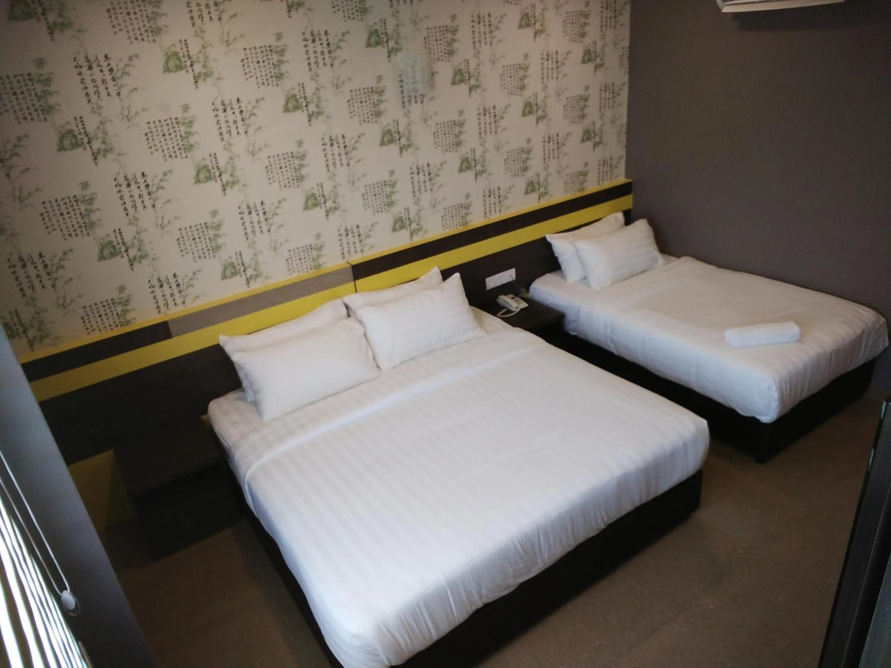 Bed in Kampar Boutique Hotel