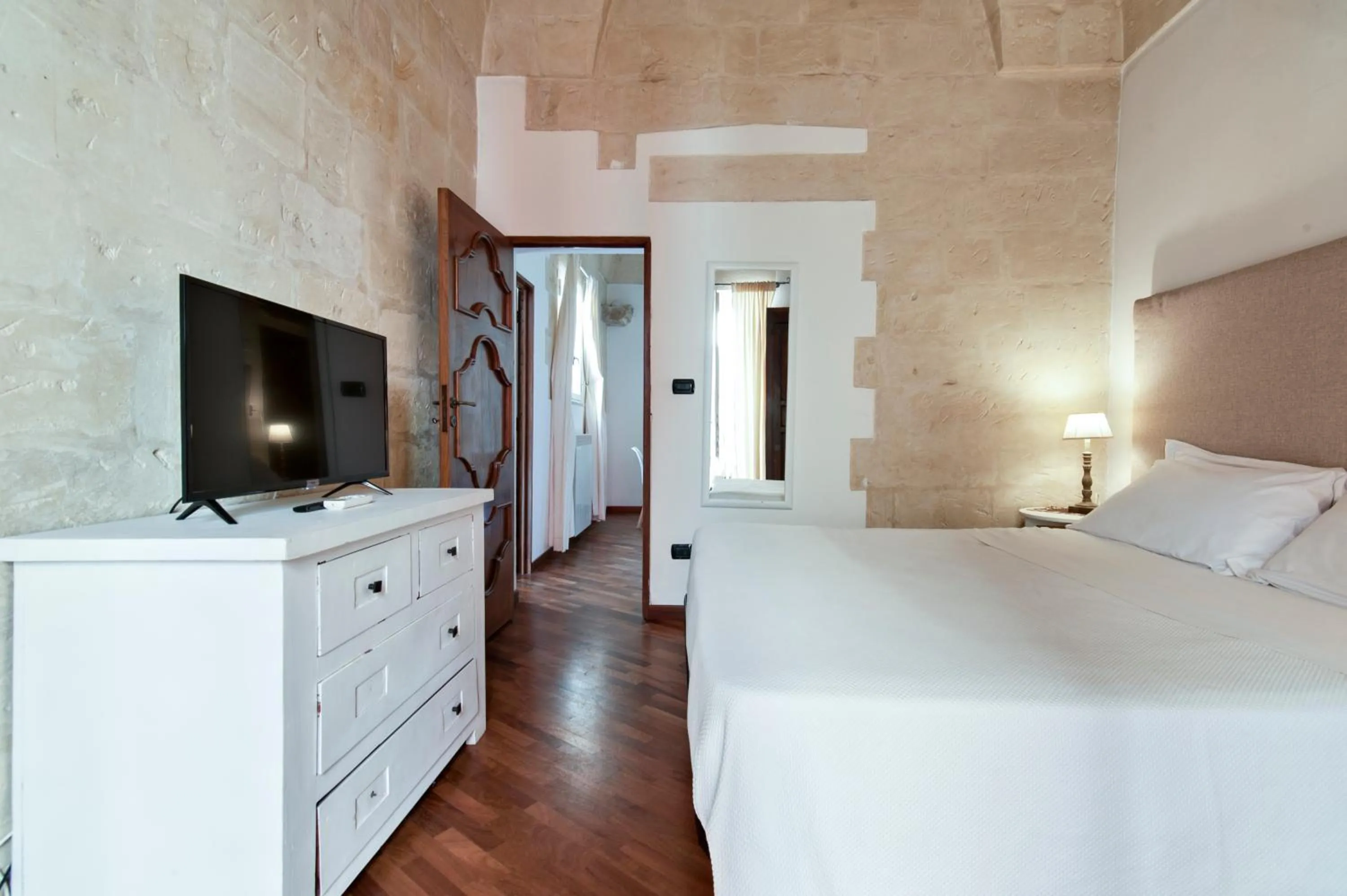 Photo of the whole room, Bed in Chiesa Greca Suites - Lecce Selection
