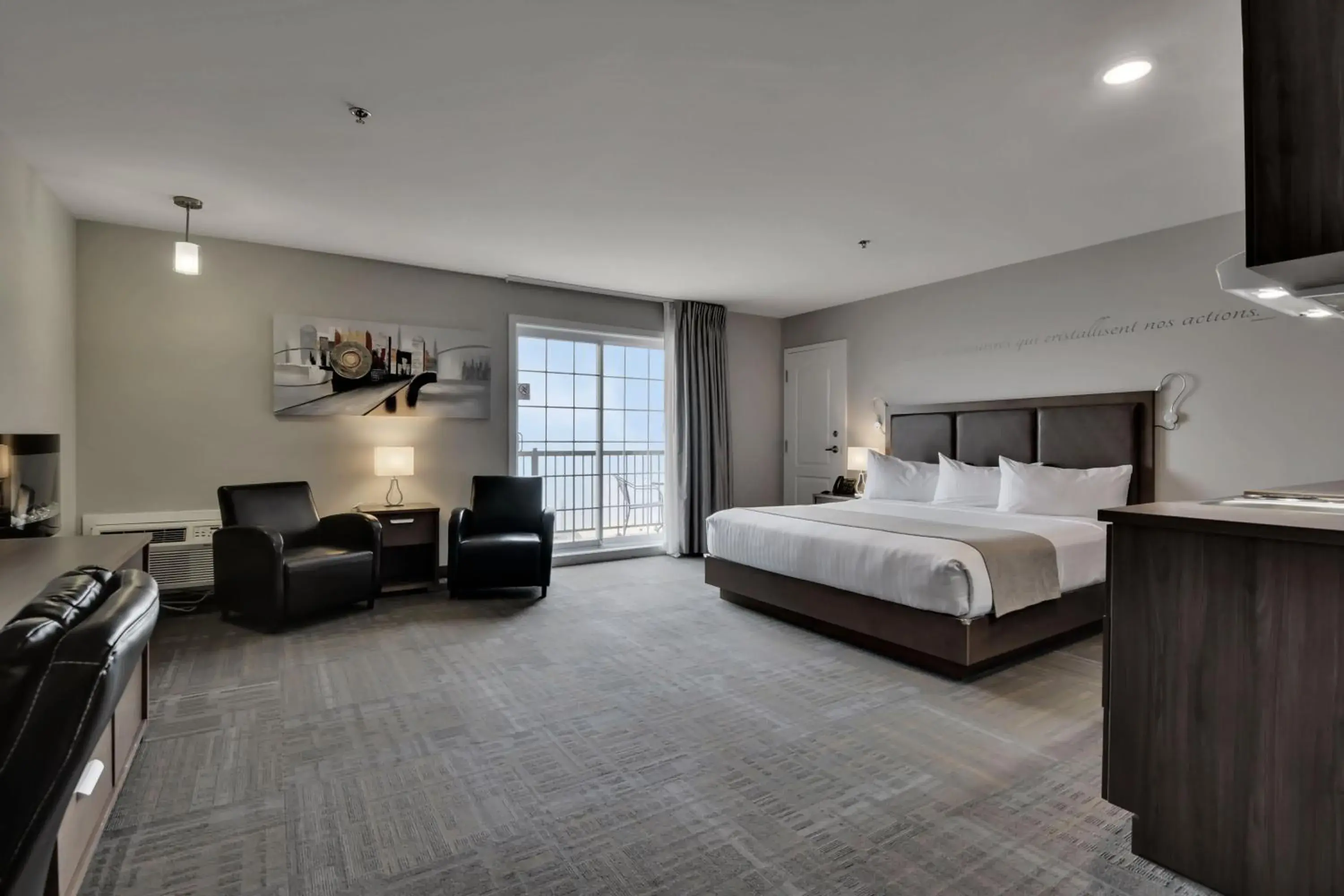 Suite, kitchenette, balcony, river view in Hôtel et Pavillons Le Petit Manoir du Casino Suite, kitchenette, balcony, river view in Hôtel et Pavillons Le Petit Manoir du Casino