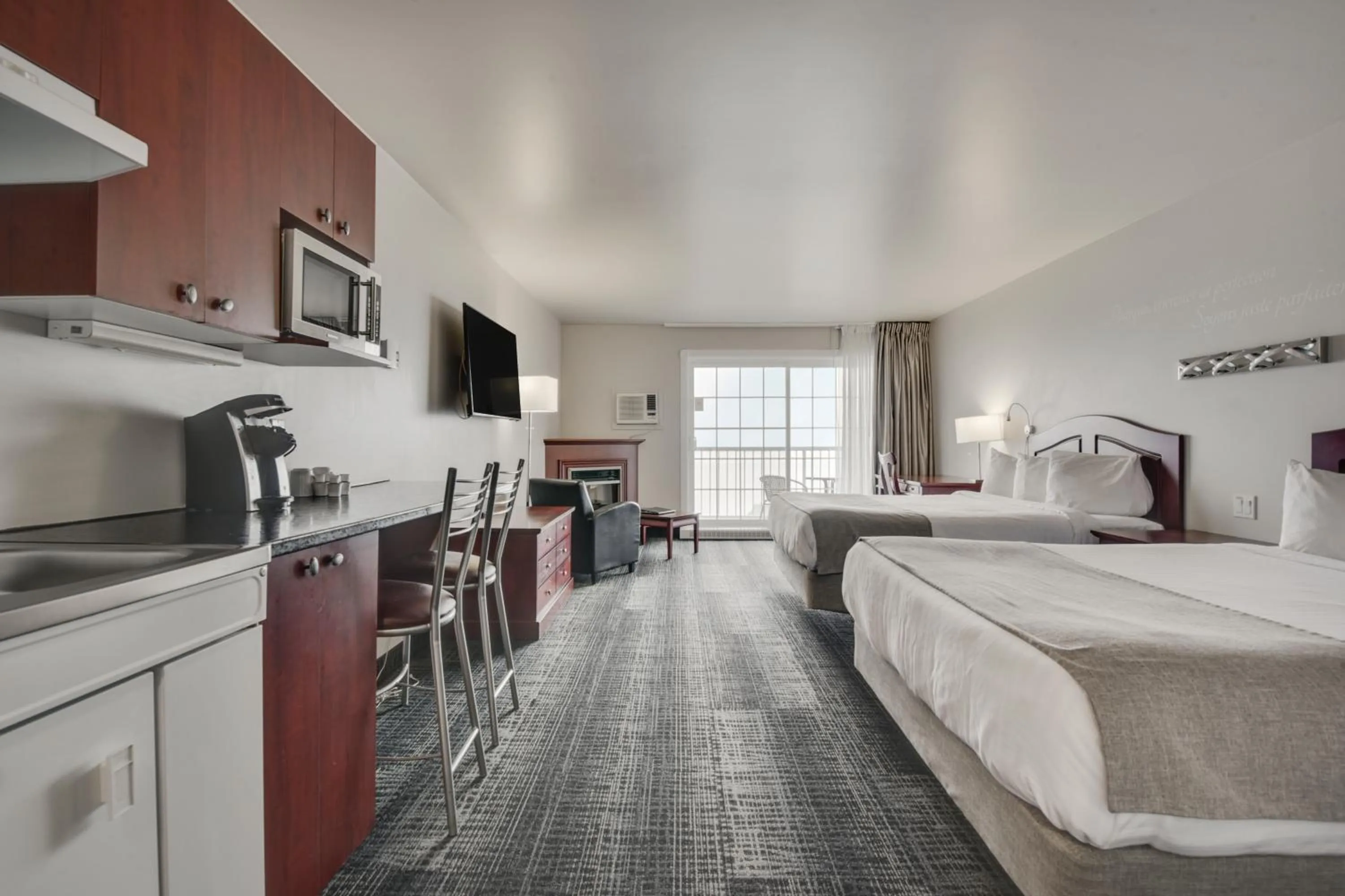 Kitchen or kitchenette, Bed in Hôtel et Pavillons Le Petit Manoir du Casino