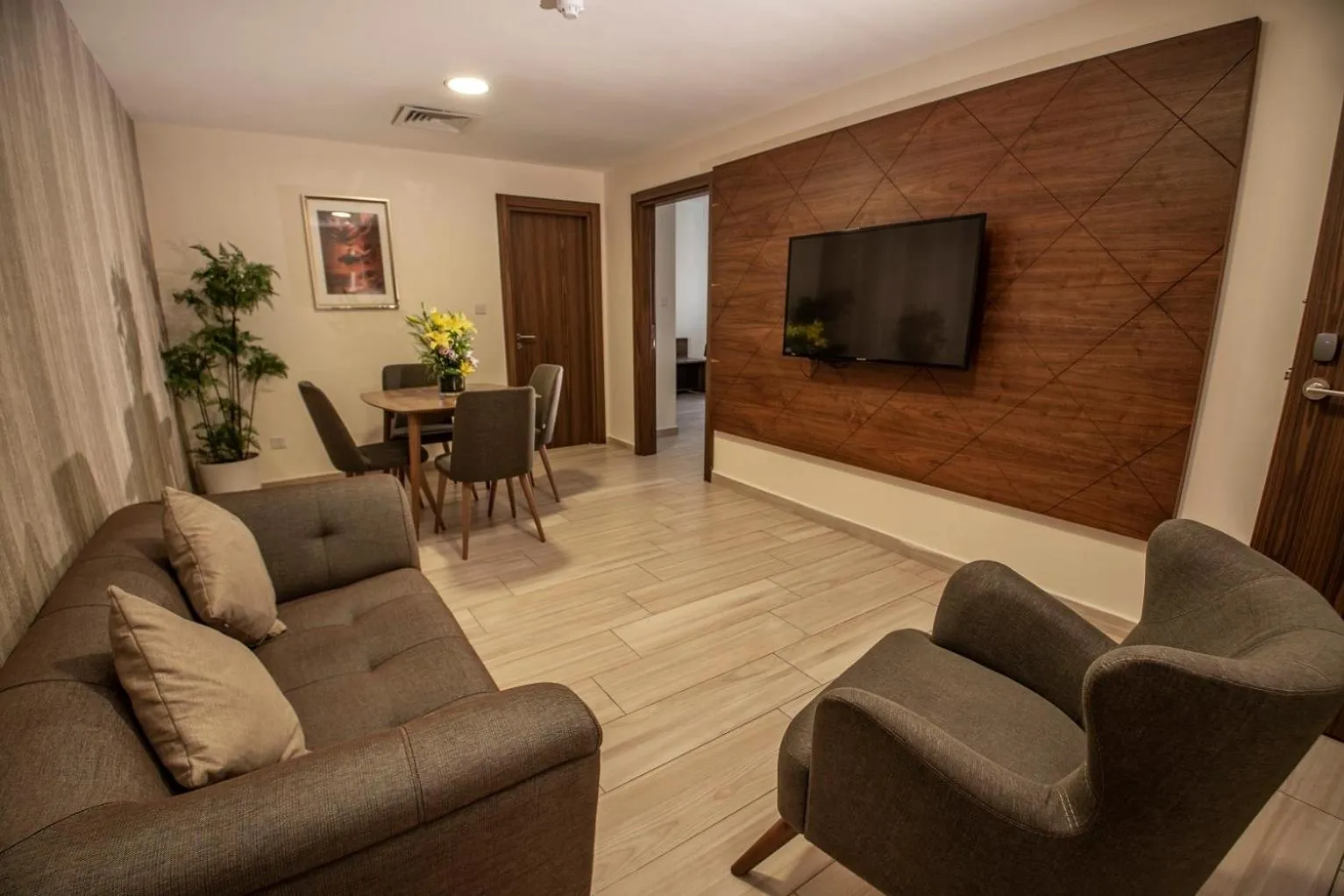 Communal lounge/ TV room in Lacosta Hotel