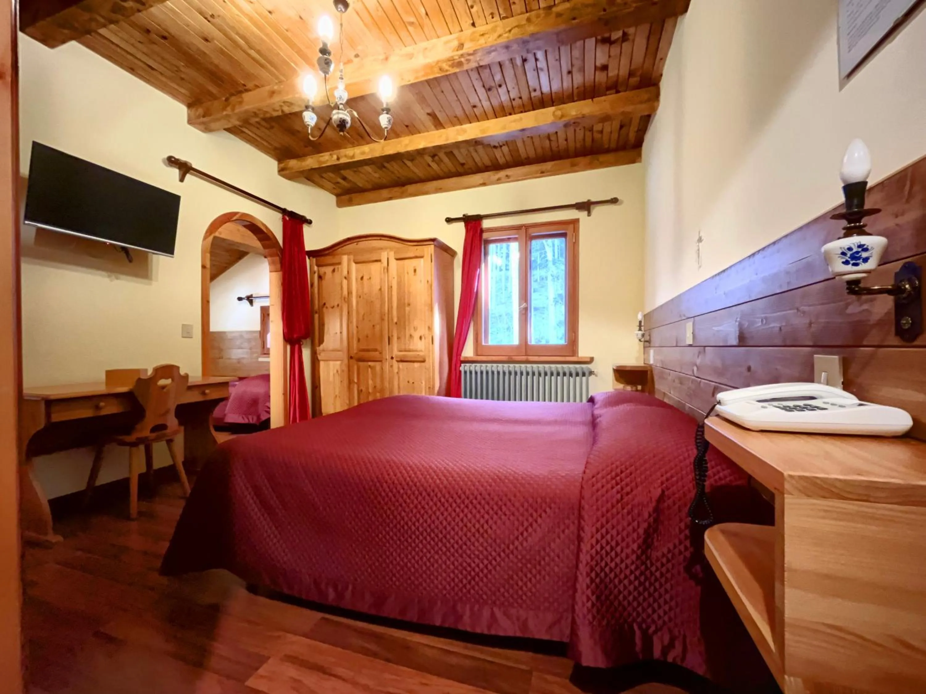 Bed in Hotel Garnì Mille Pini