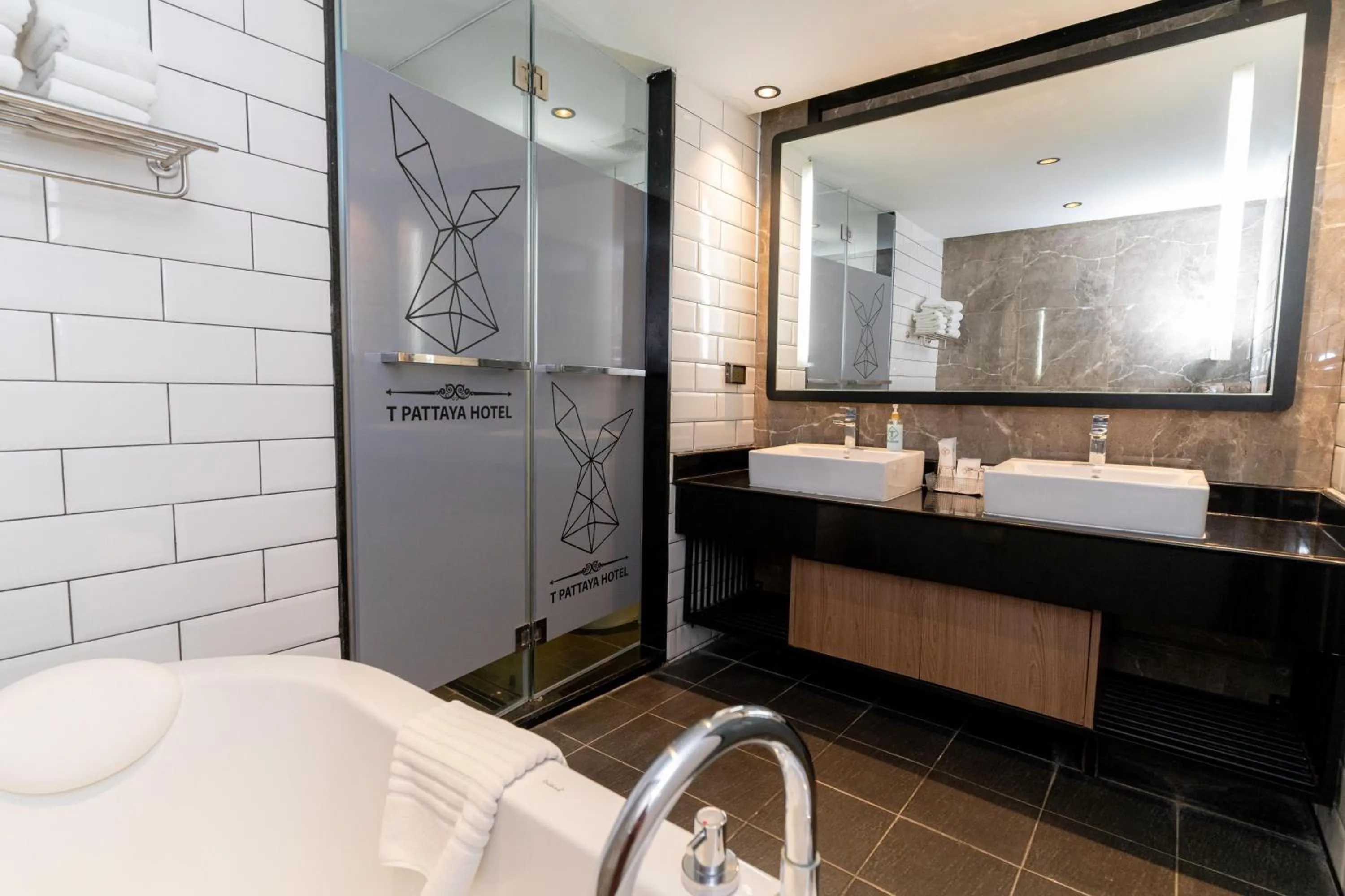 Bathroom in SureStay Plus by Best Western T Pattaya