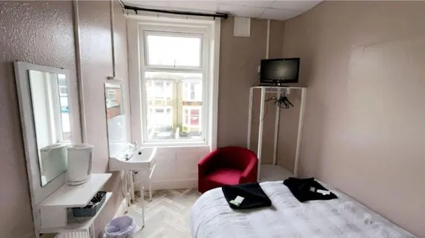 Bed in The Merlin Hotel