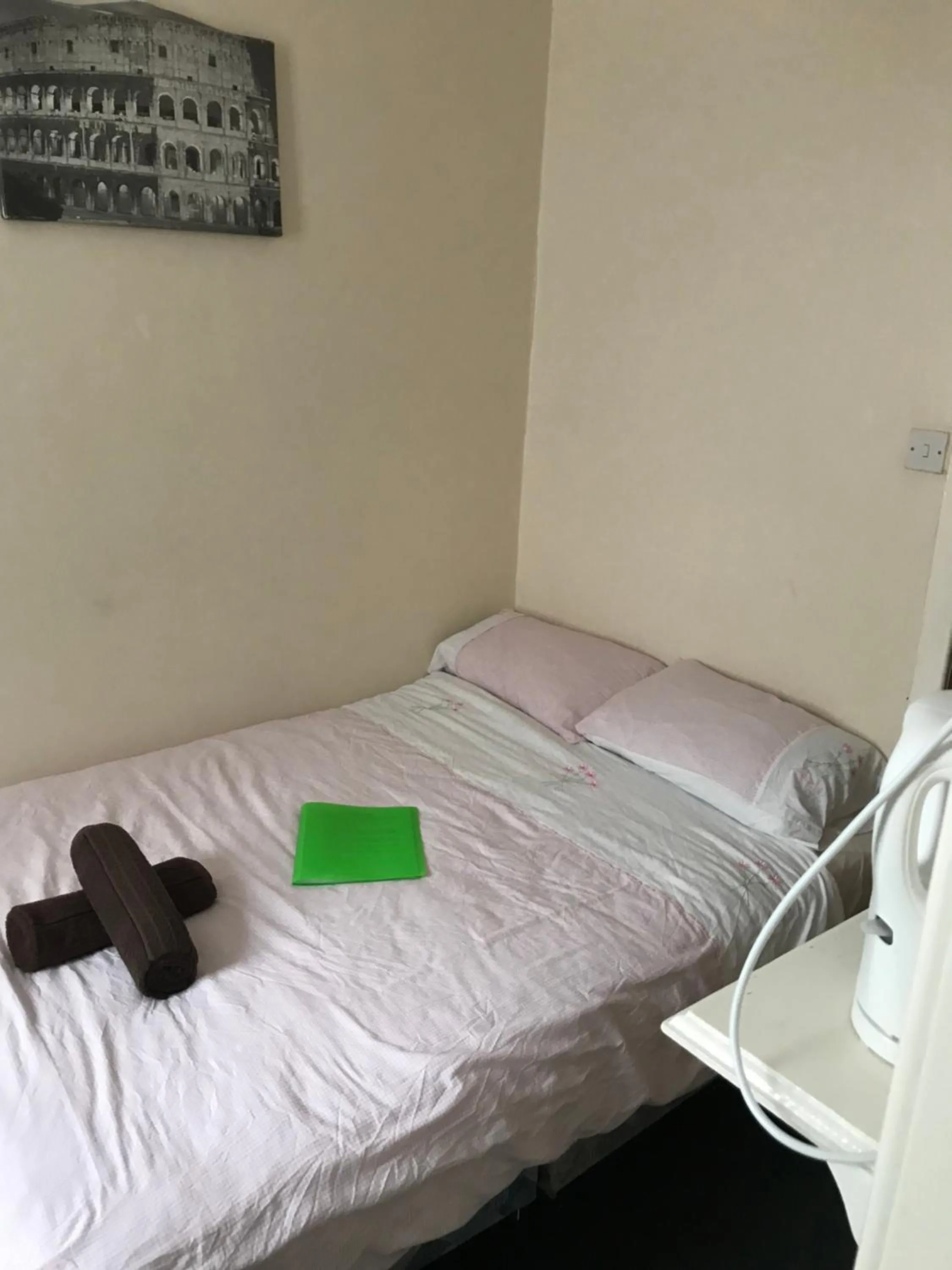 Bed in The Merlin Hotel