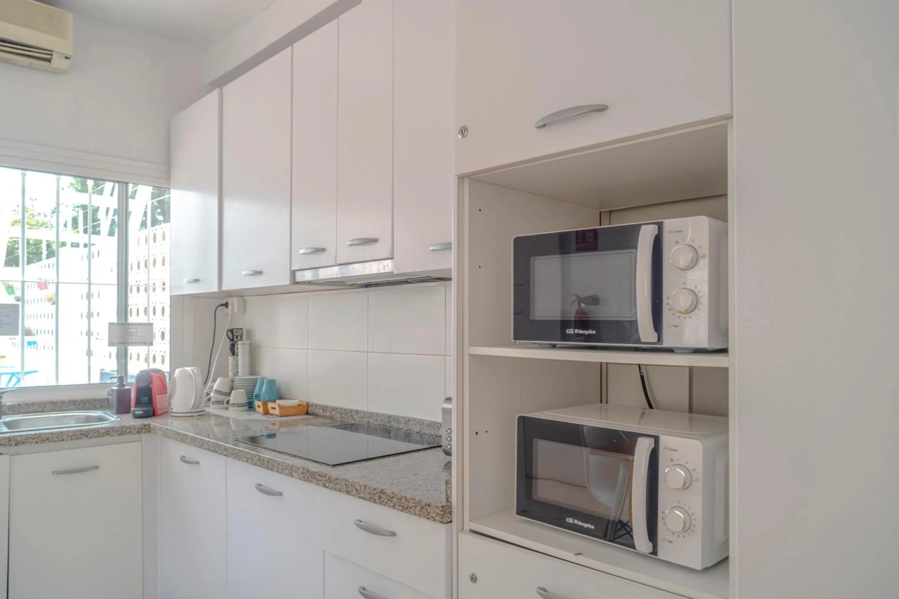 Communal kitchen in La Moraga de Poniente Malaga Hostel