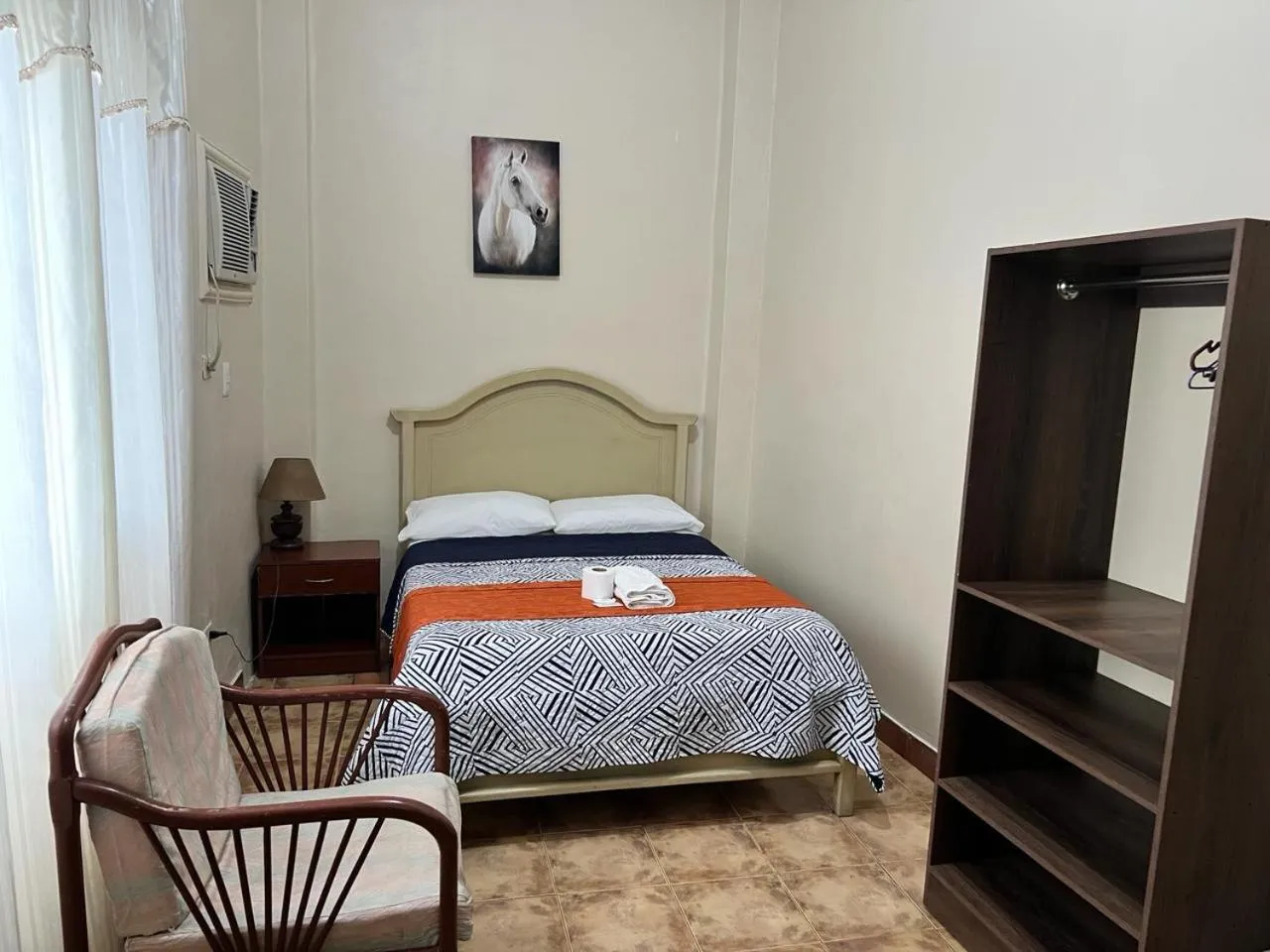 Bed in Atlantic Suites Hotel