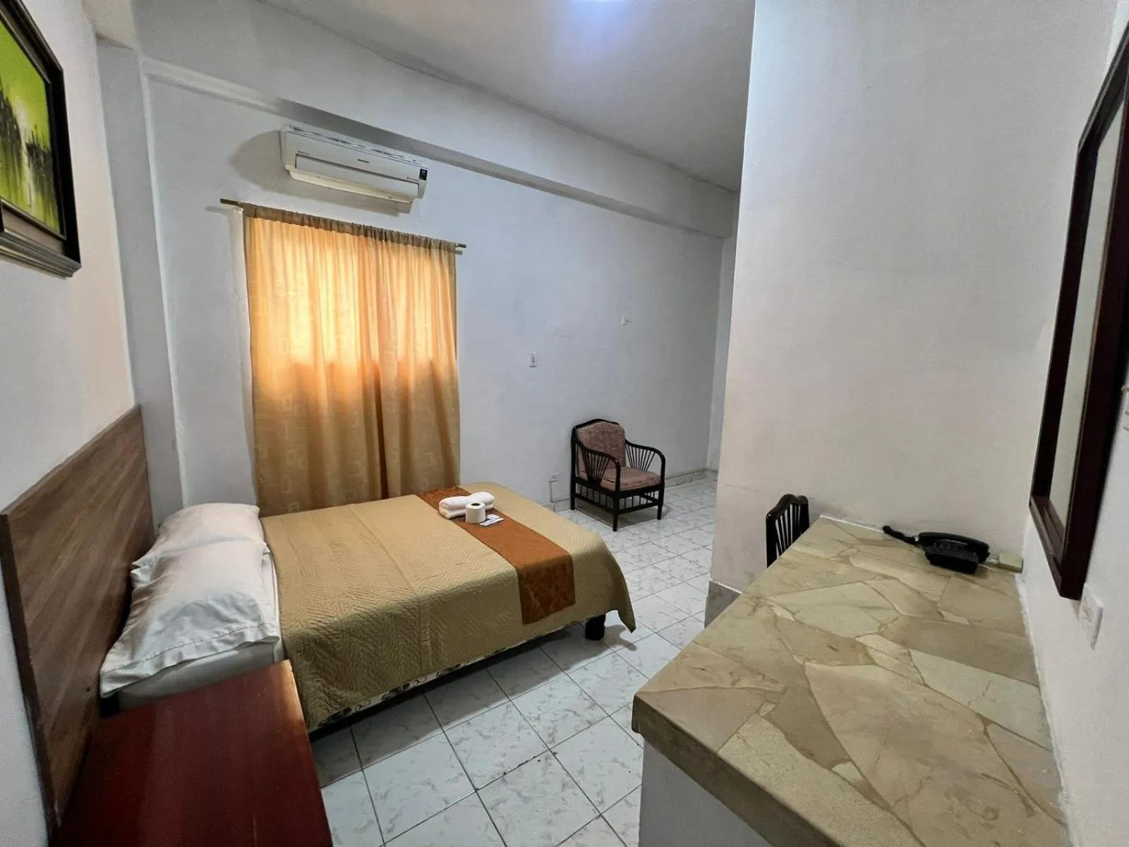 Bed in Atlantic Suites Hotel