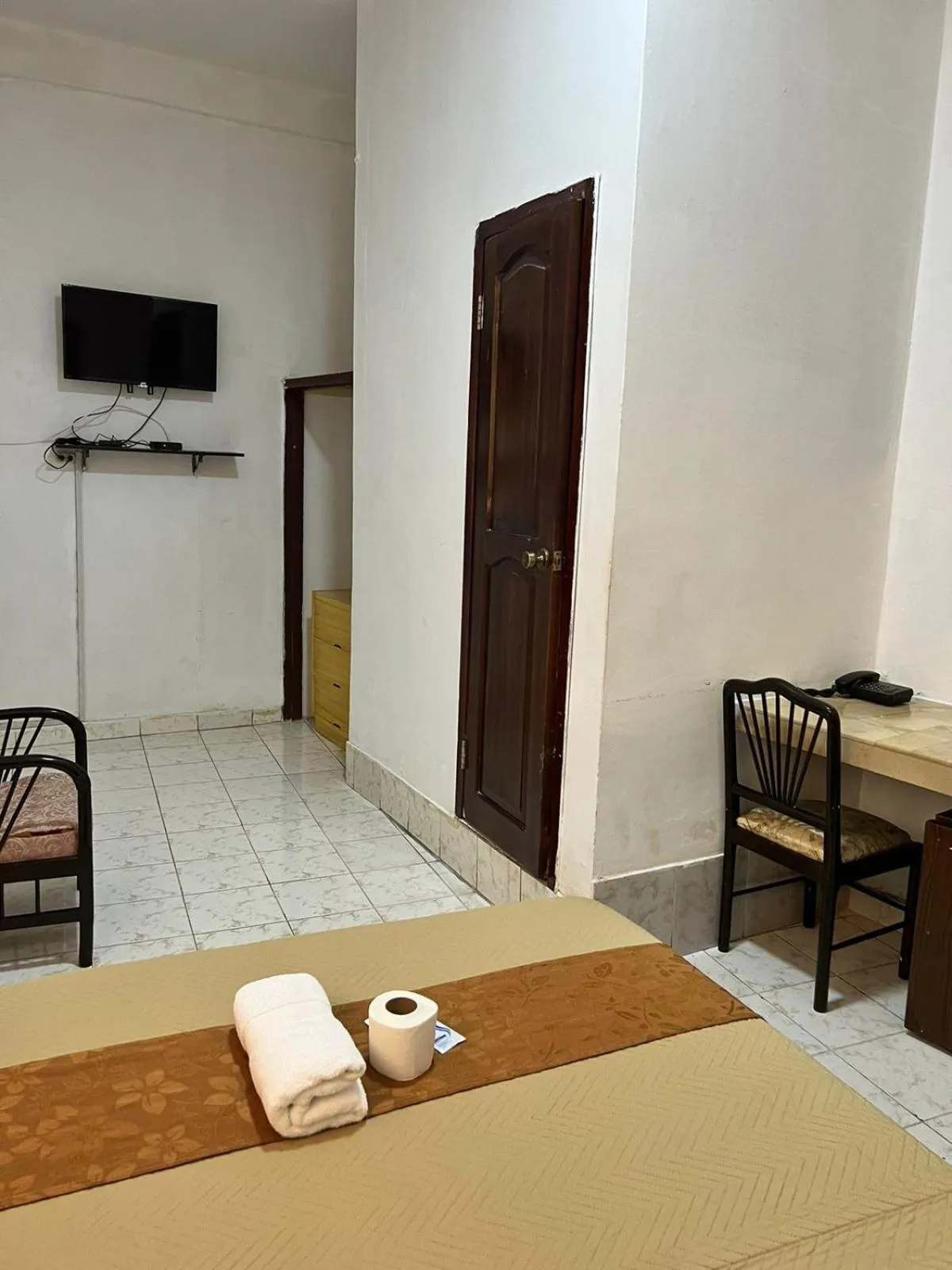 Bed in Atlantic Suites Hotel