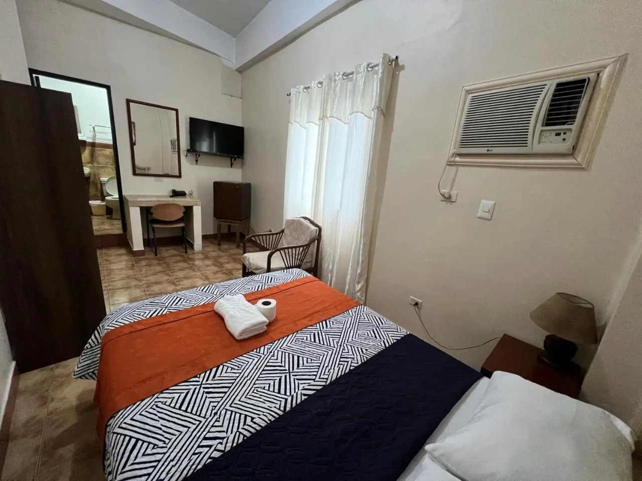 Bed in Atlantic Suites Hotel