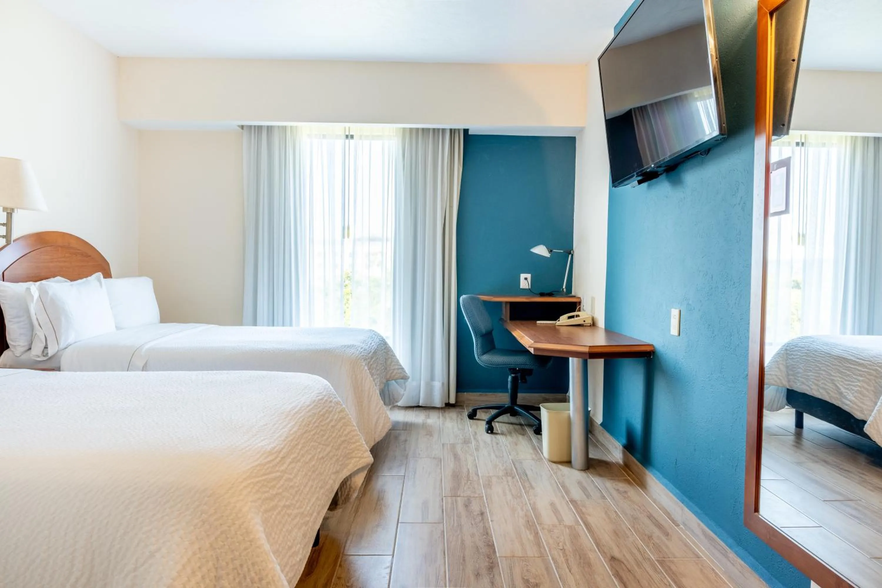 Photo of the whole room, Bed in Fiesta Inn Poza Rica