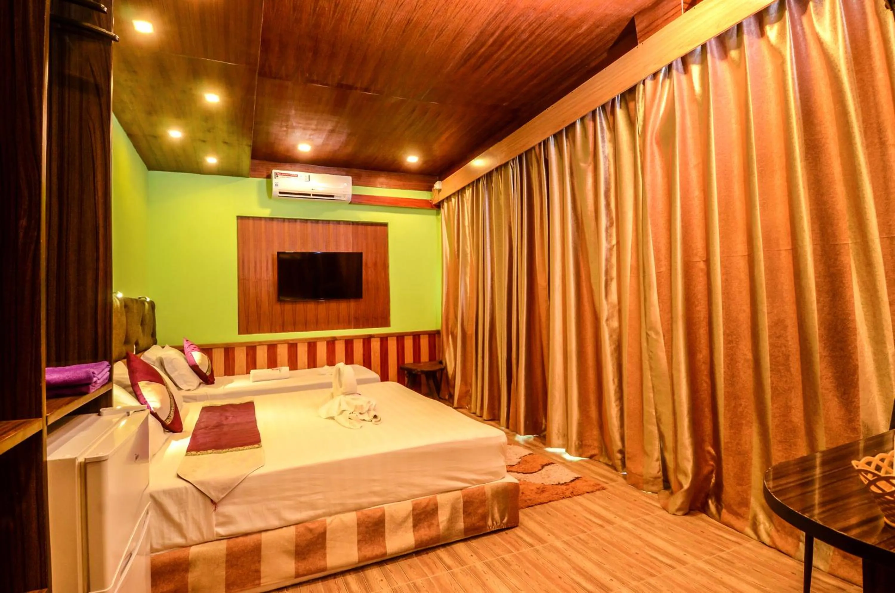 Bed in Summer Villa Guest House