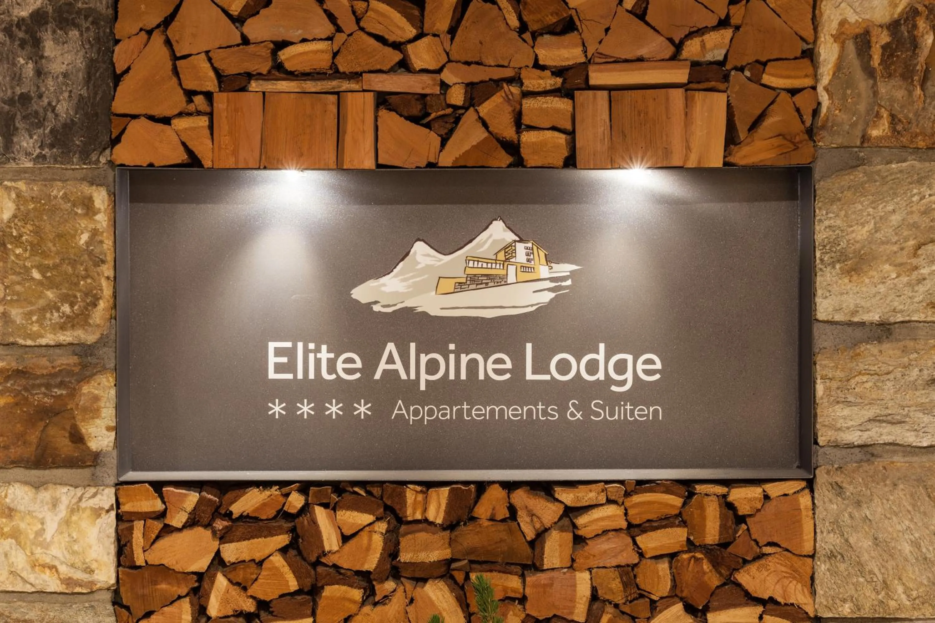Property logo or sign in Elite Alpine Lodge - Apart & Breakfast