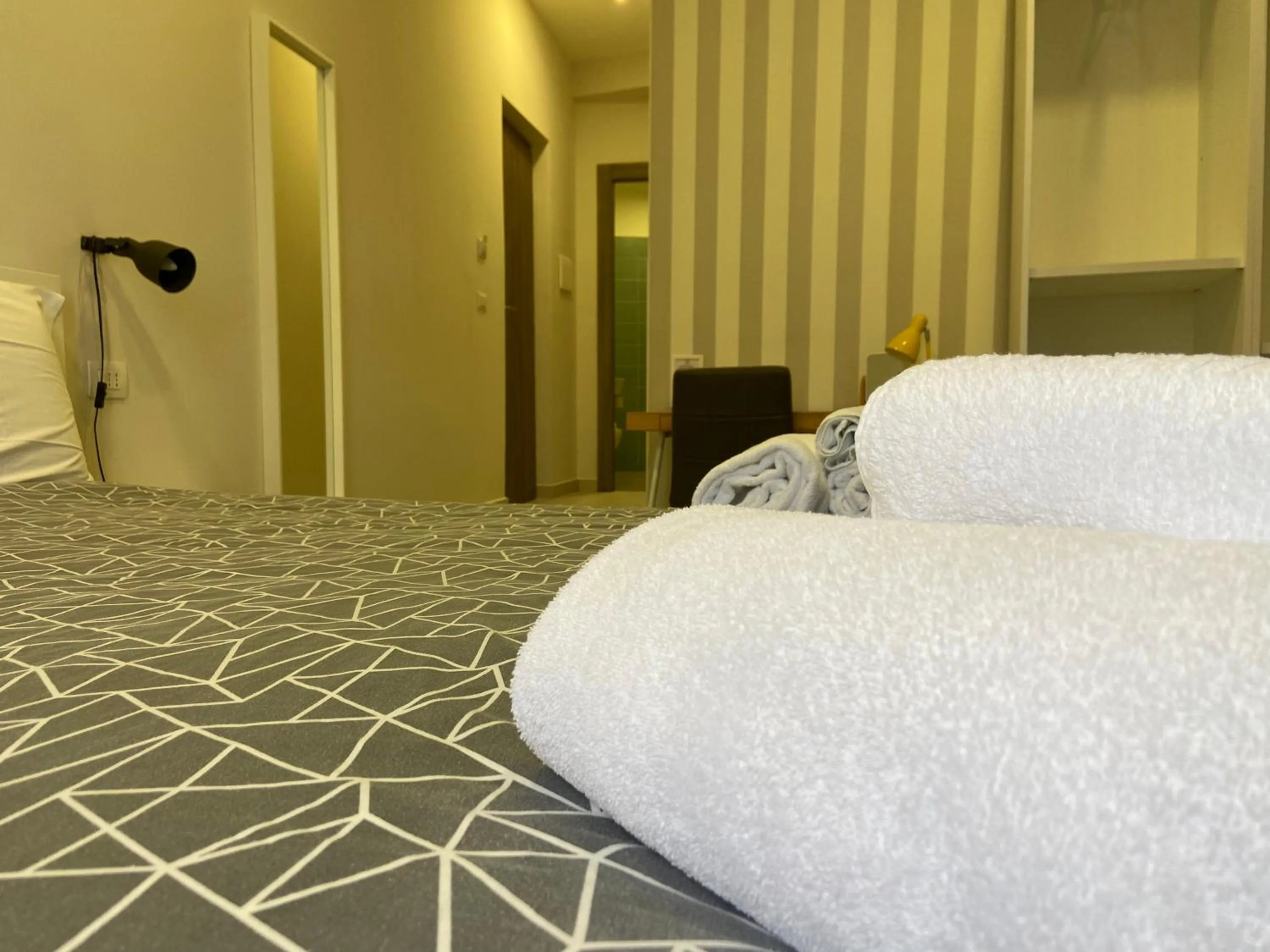 Bed in 2Naples Rooms