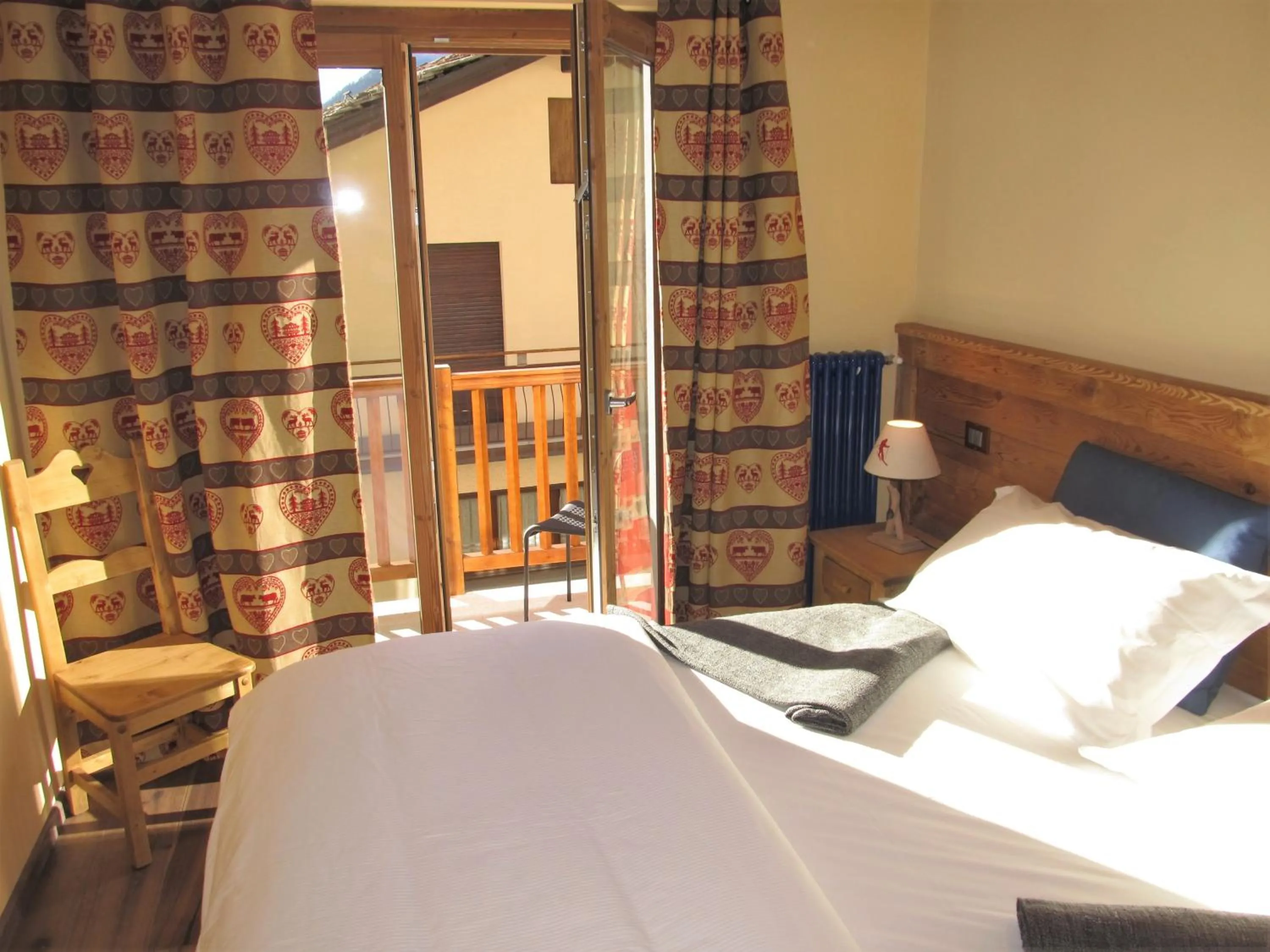 Photo of the whole room, Bed in Miramonti