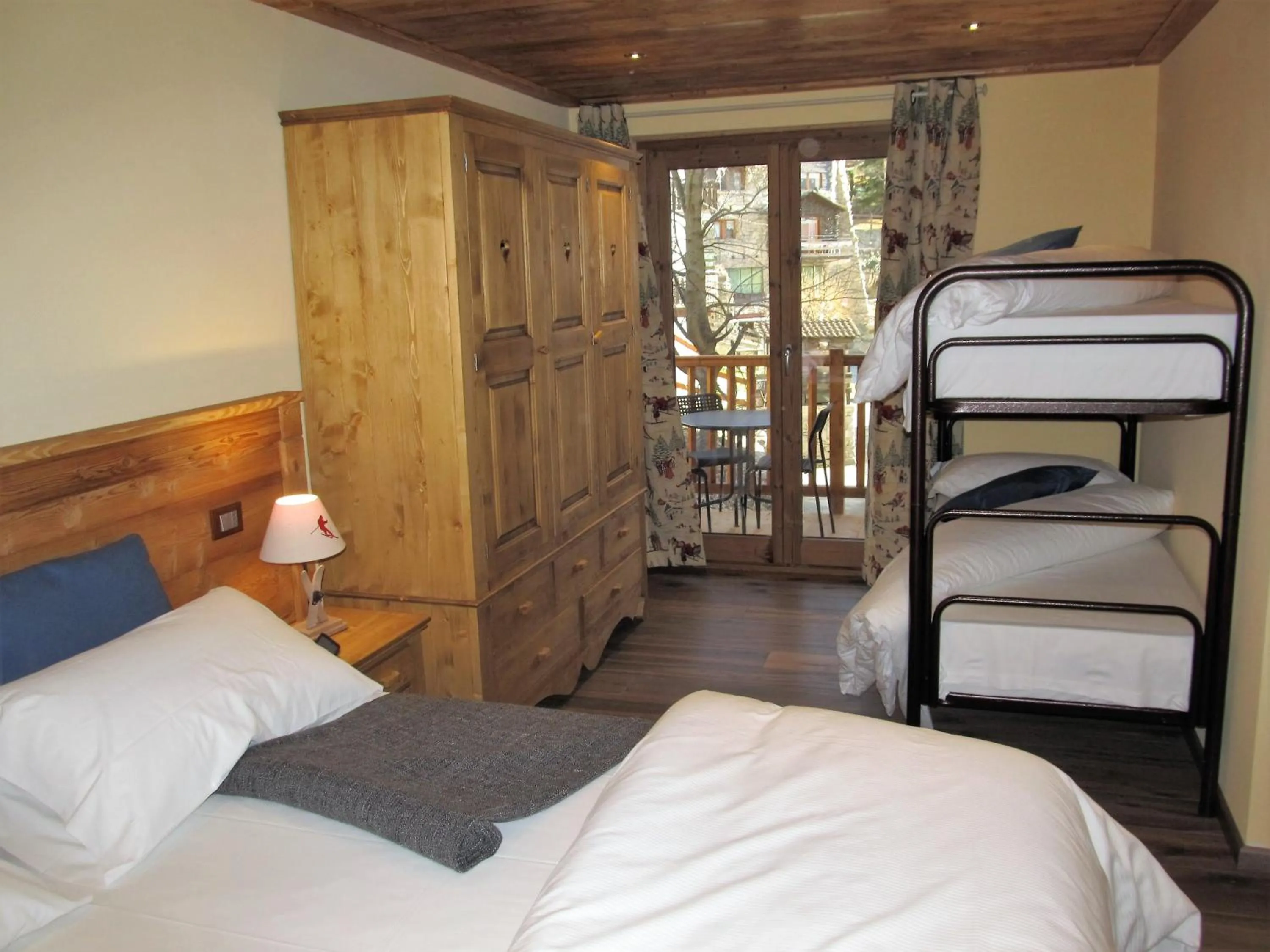 Photo of the whole room, Bed in Miramonti