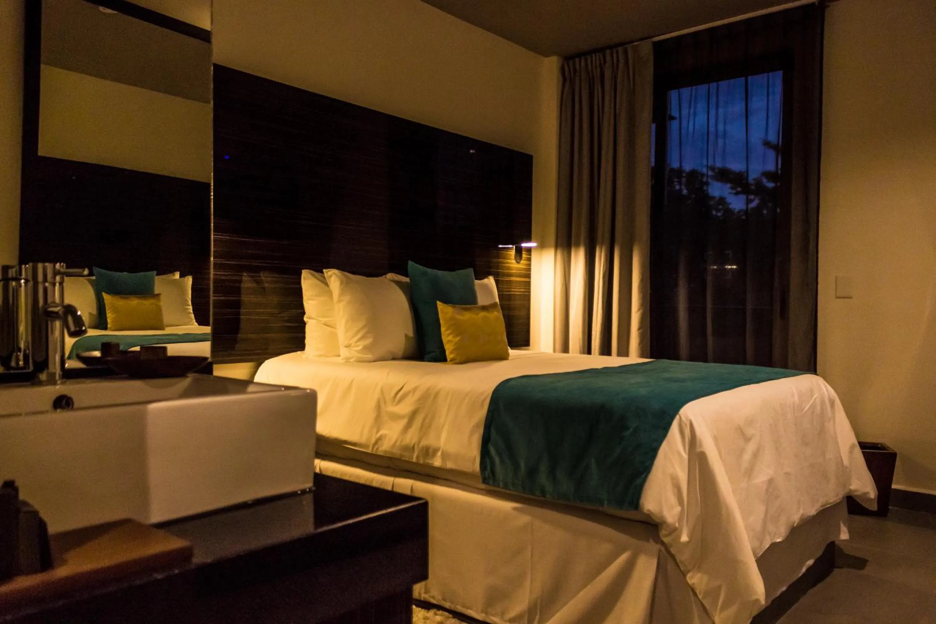 Photo of the whole room, Bed in KABAH Cancun Hotel Boutique