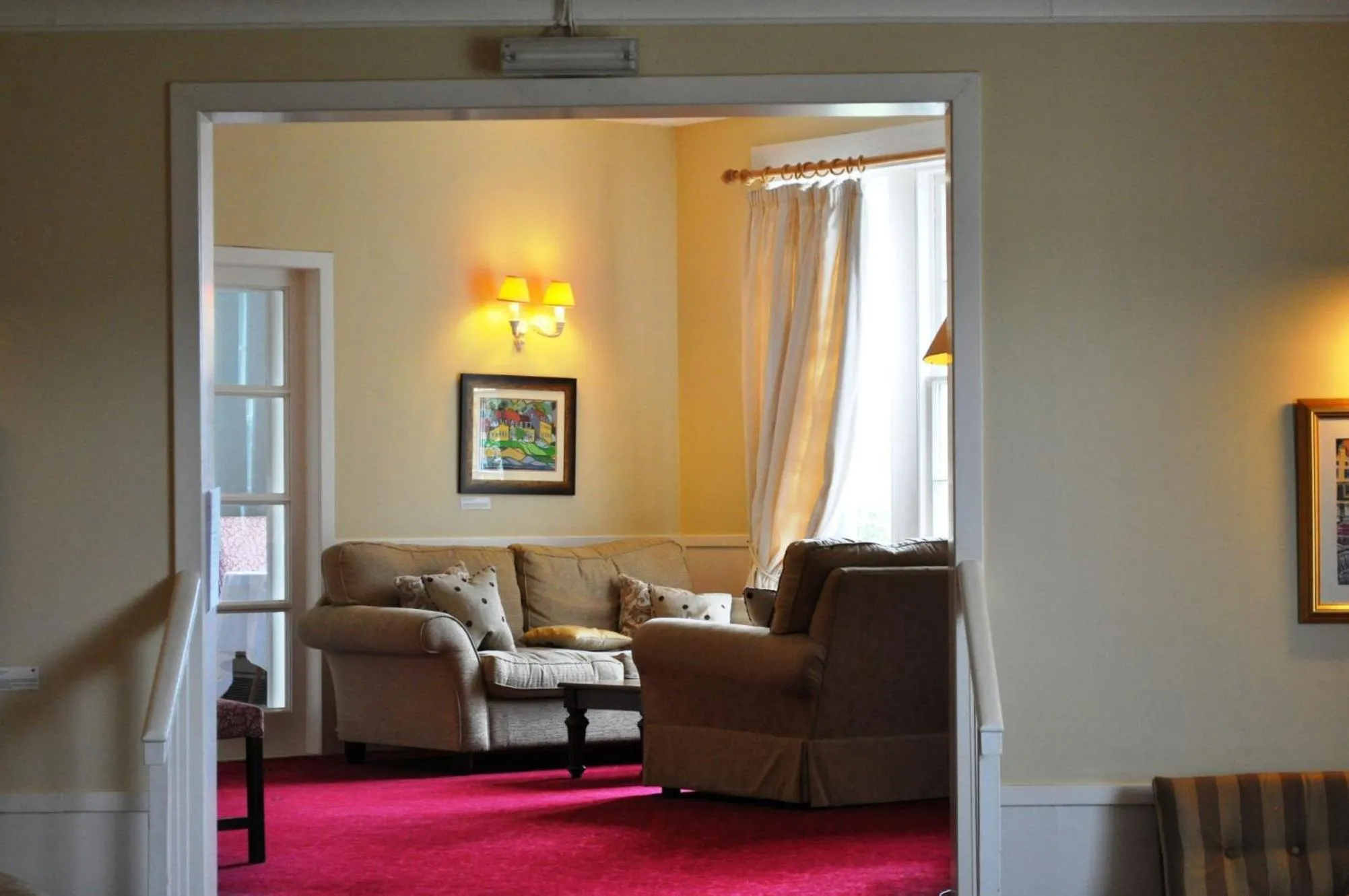 Communal lounge/ TV room in The Creggans Inn