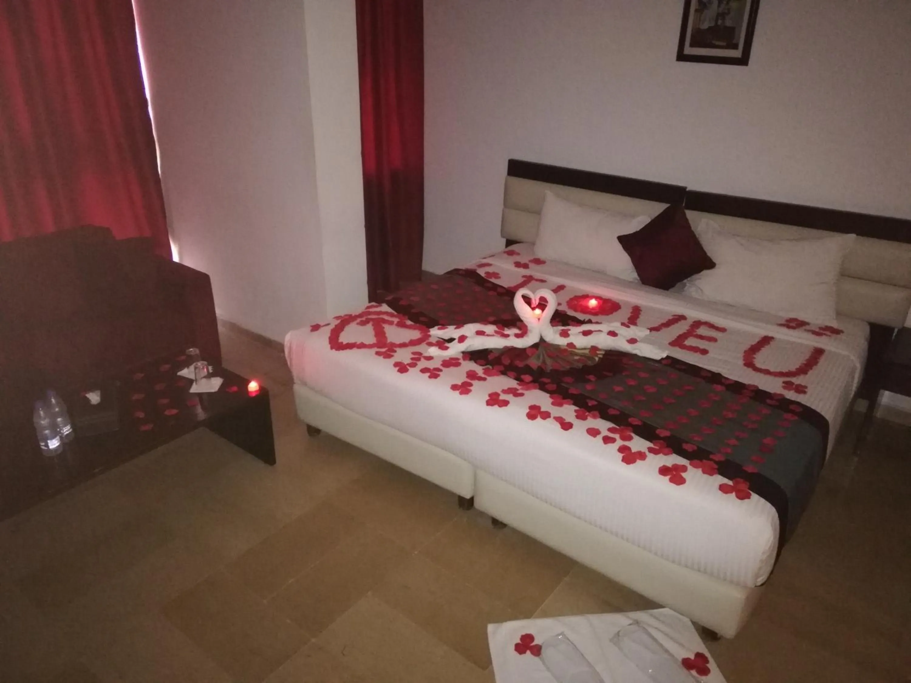 Decorative detail, Bed in Bliss 3000 Furnished Studios