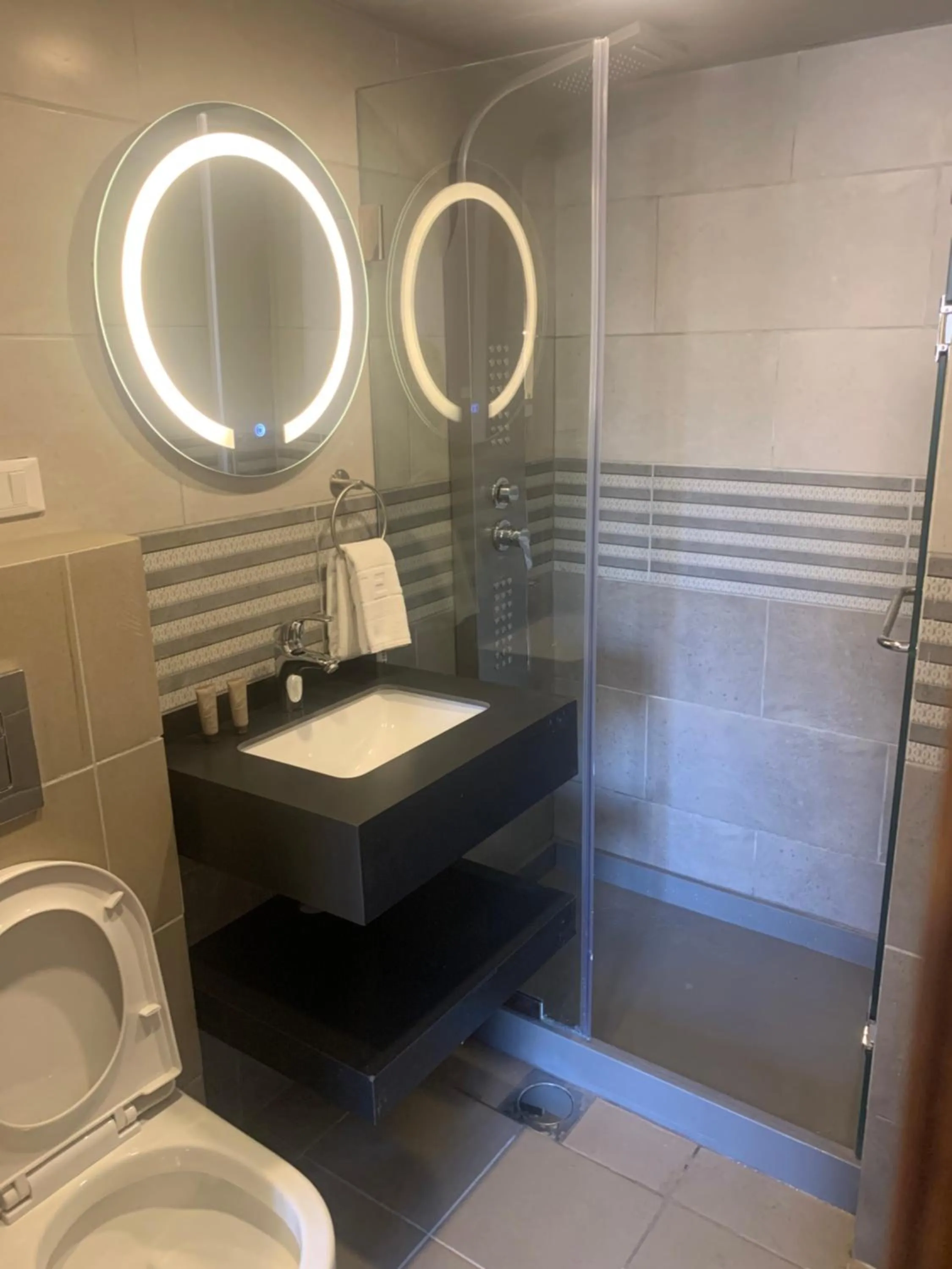 Shower in Bliss 3000 Furnished Studios