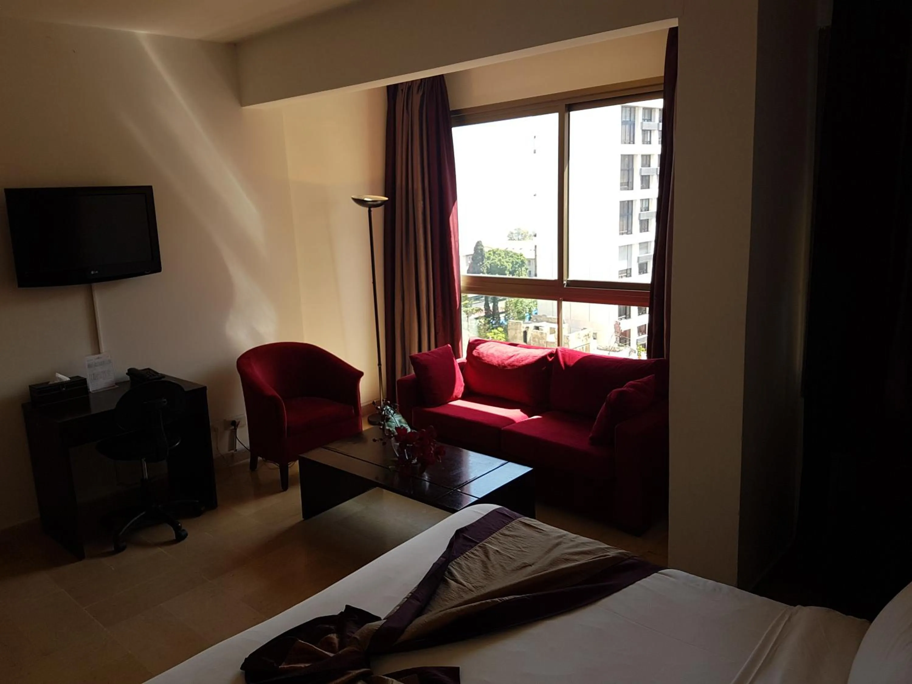 Living room, Bed in Bliss 3000 Furnished Studios