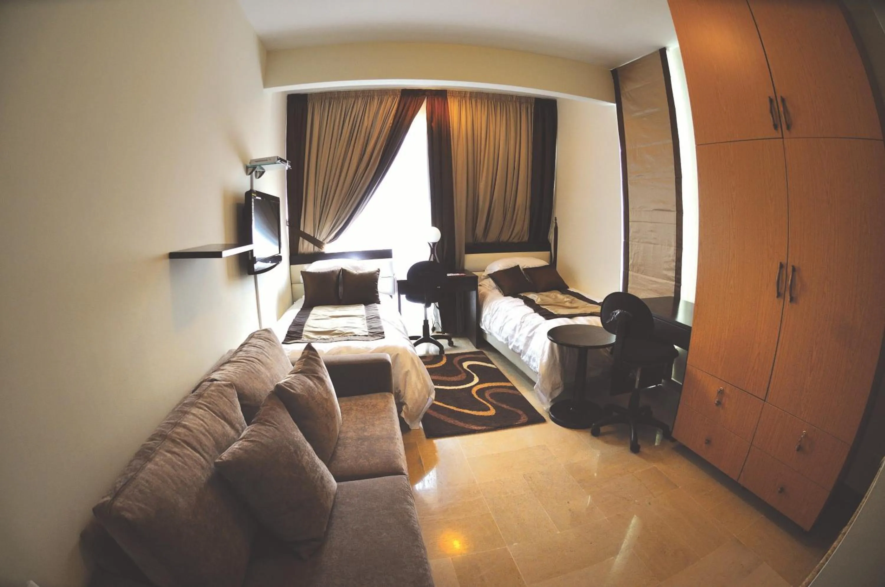 Living room, Bed in Bliss 3000 Furnished Studios