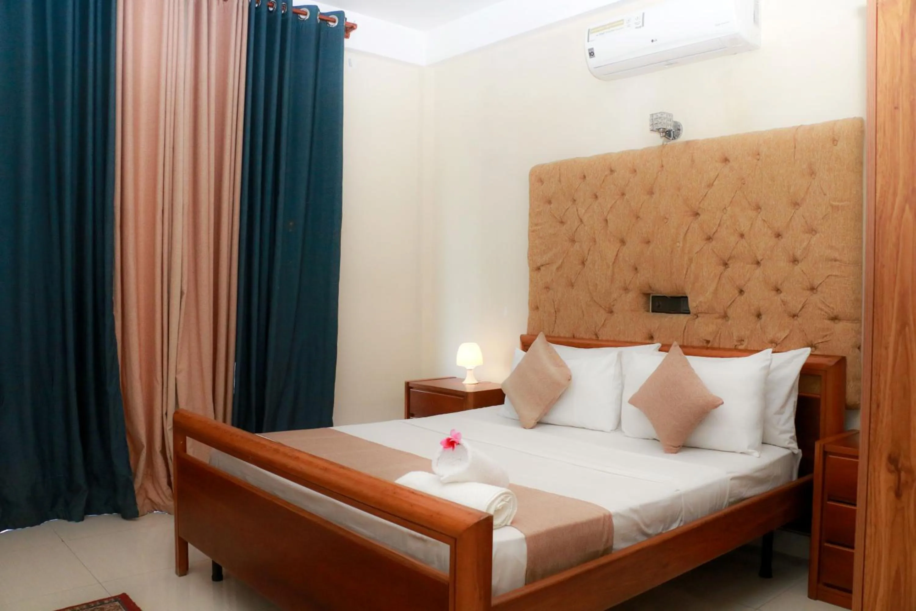 Bed in Queens Beach Hotel