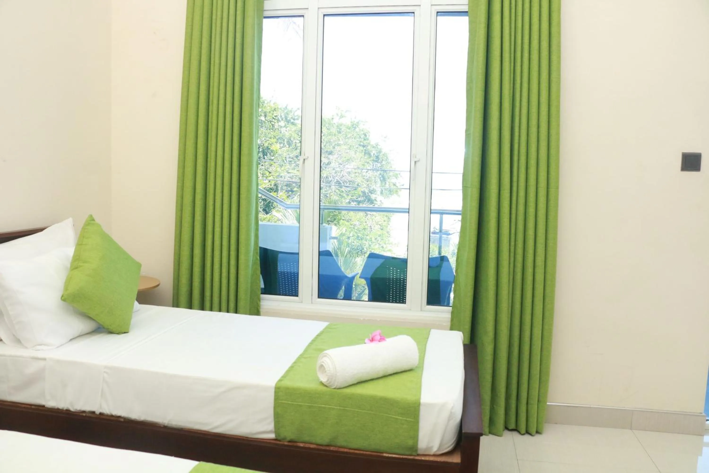 Bed in Queens Beach Hotel