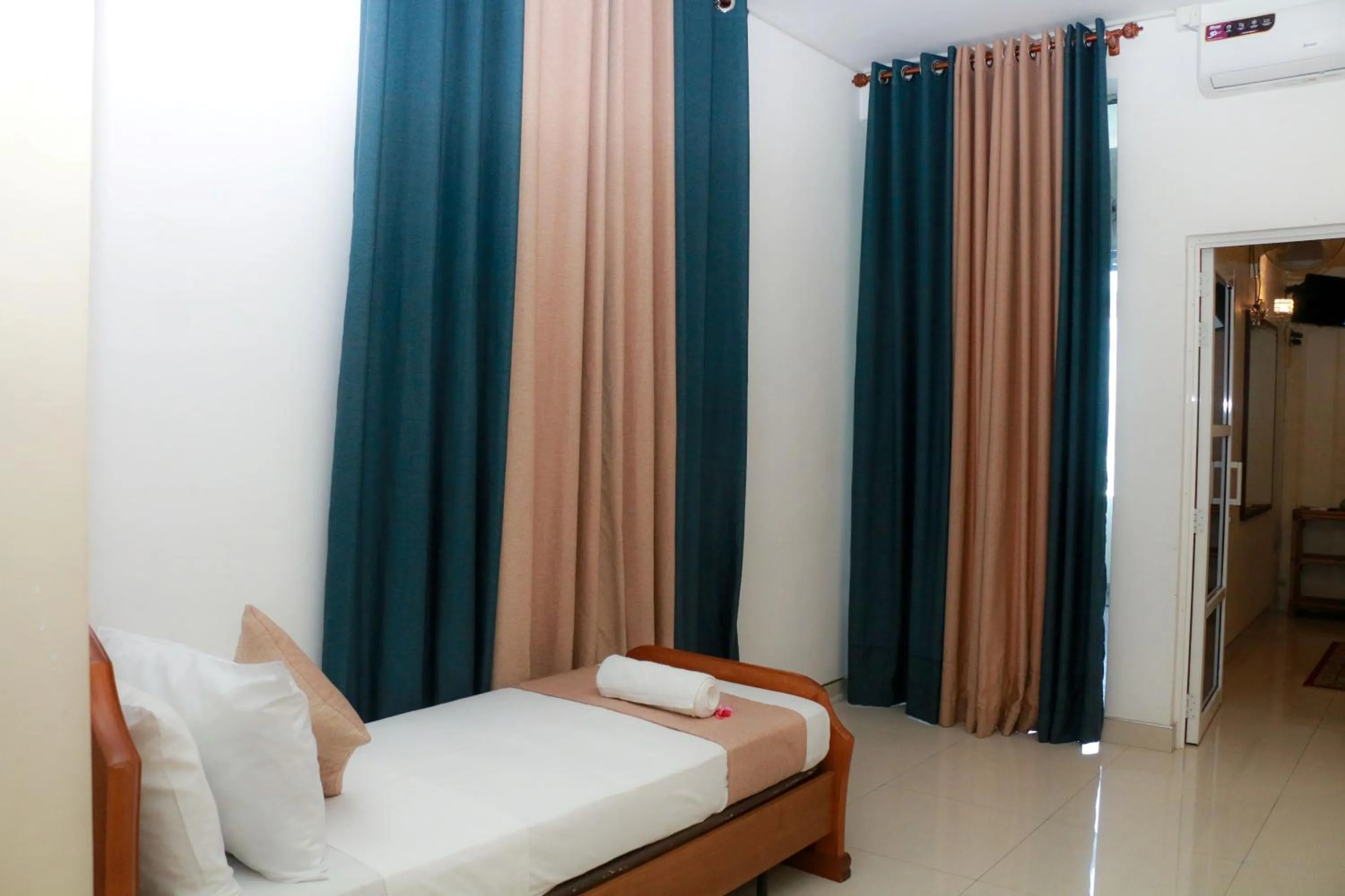 Bed in Queens Beach Hotel