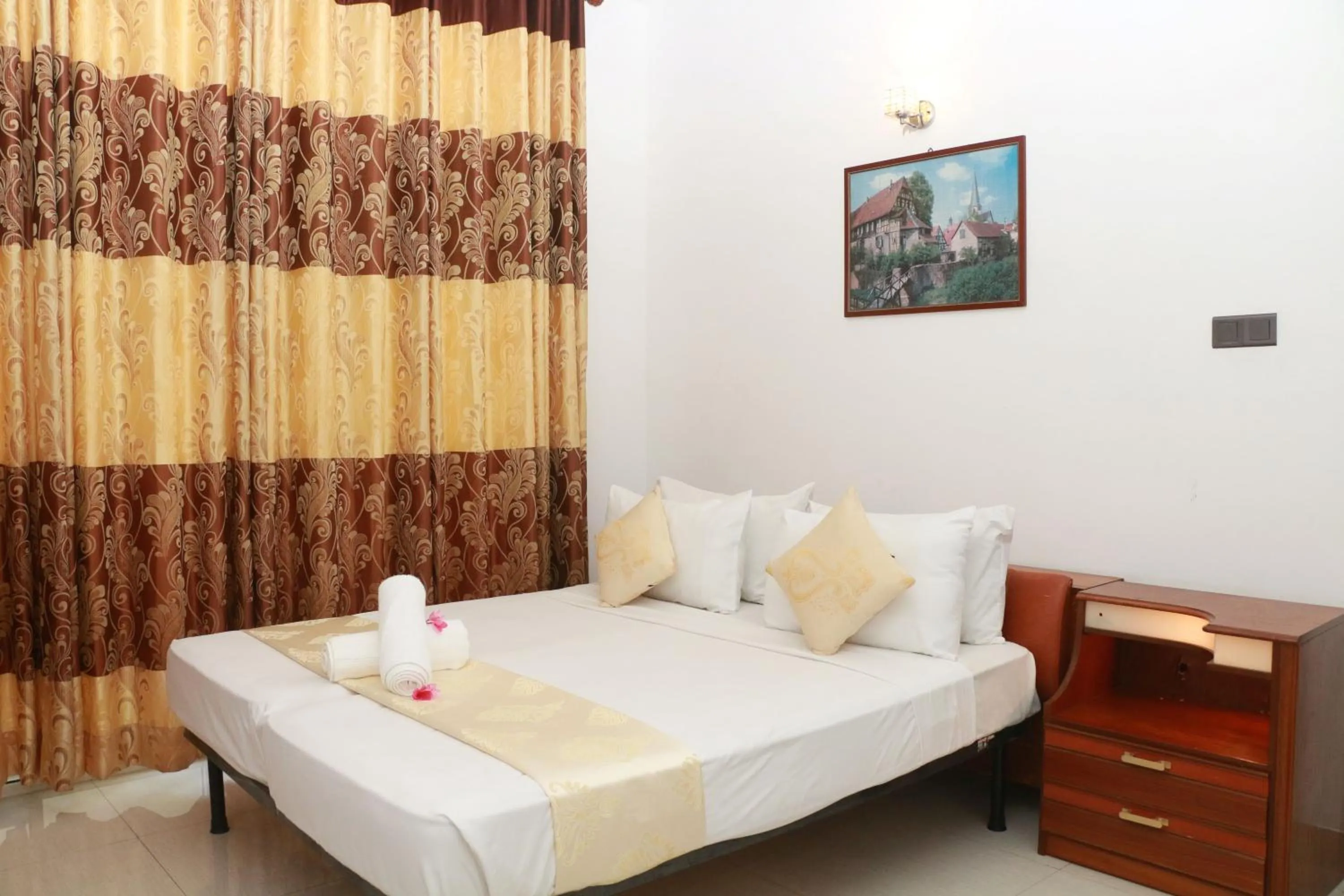 Bed in Queens Beach Hotel