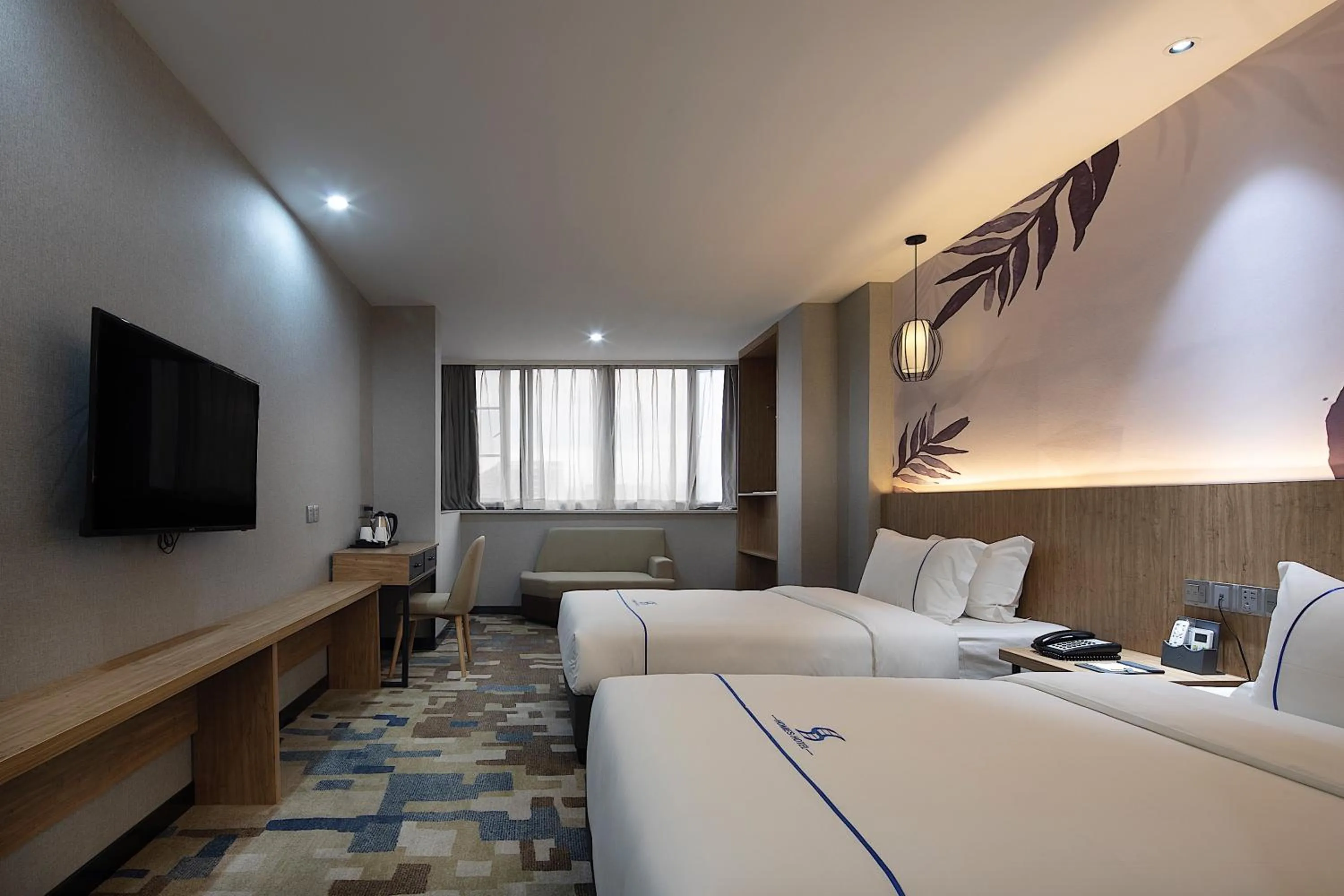 Bed in Guangzhou Homies Hotel