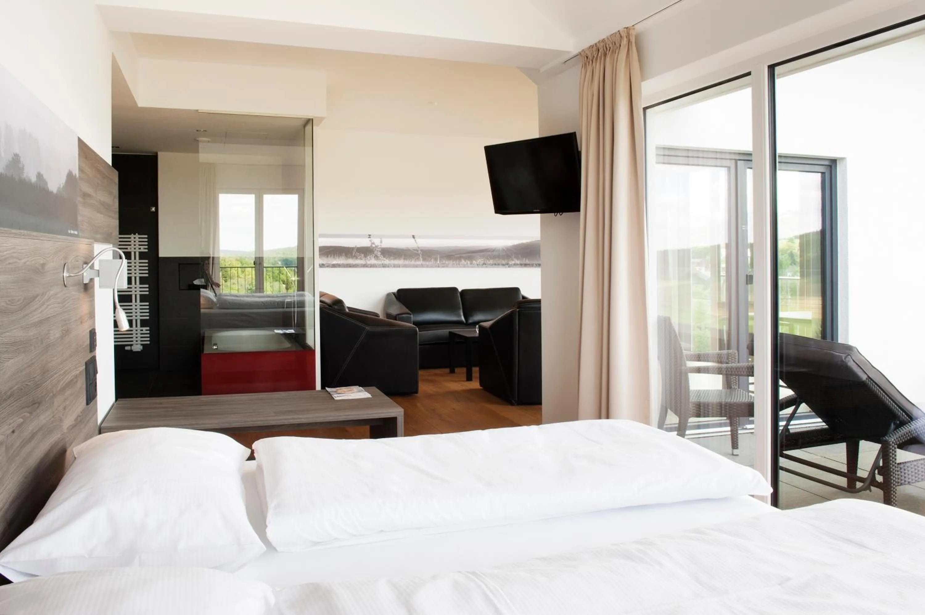 Living room, Bed in BURGHOF - DAS HOTEL