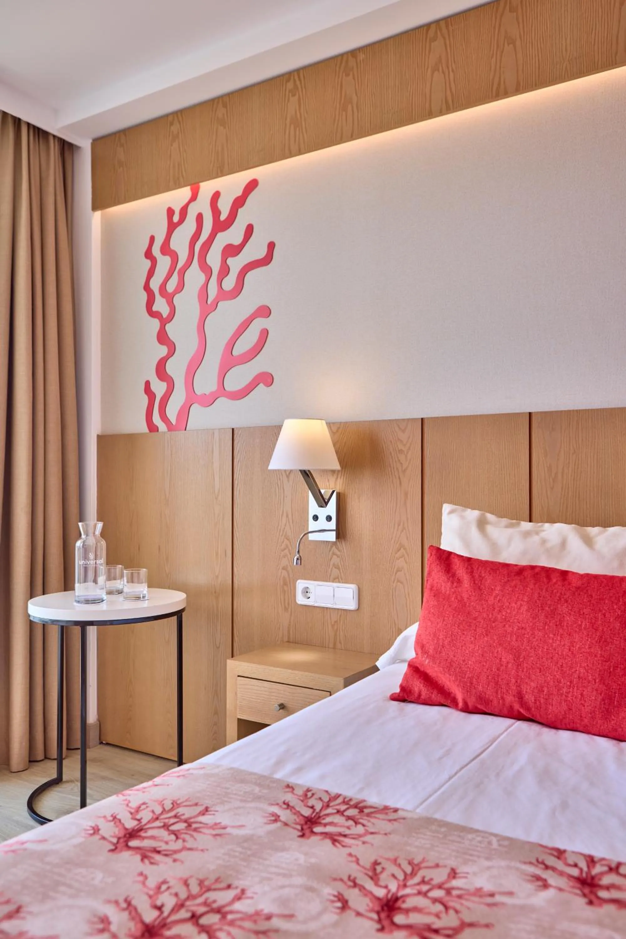 Bed in Universal Hotel Perla