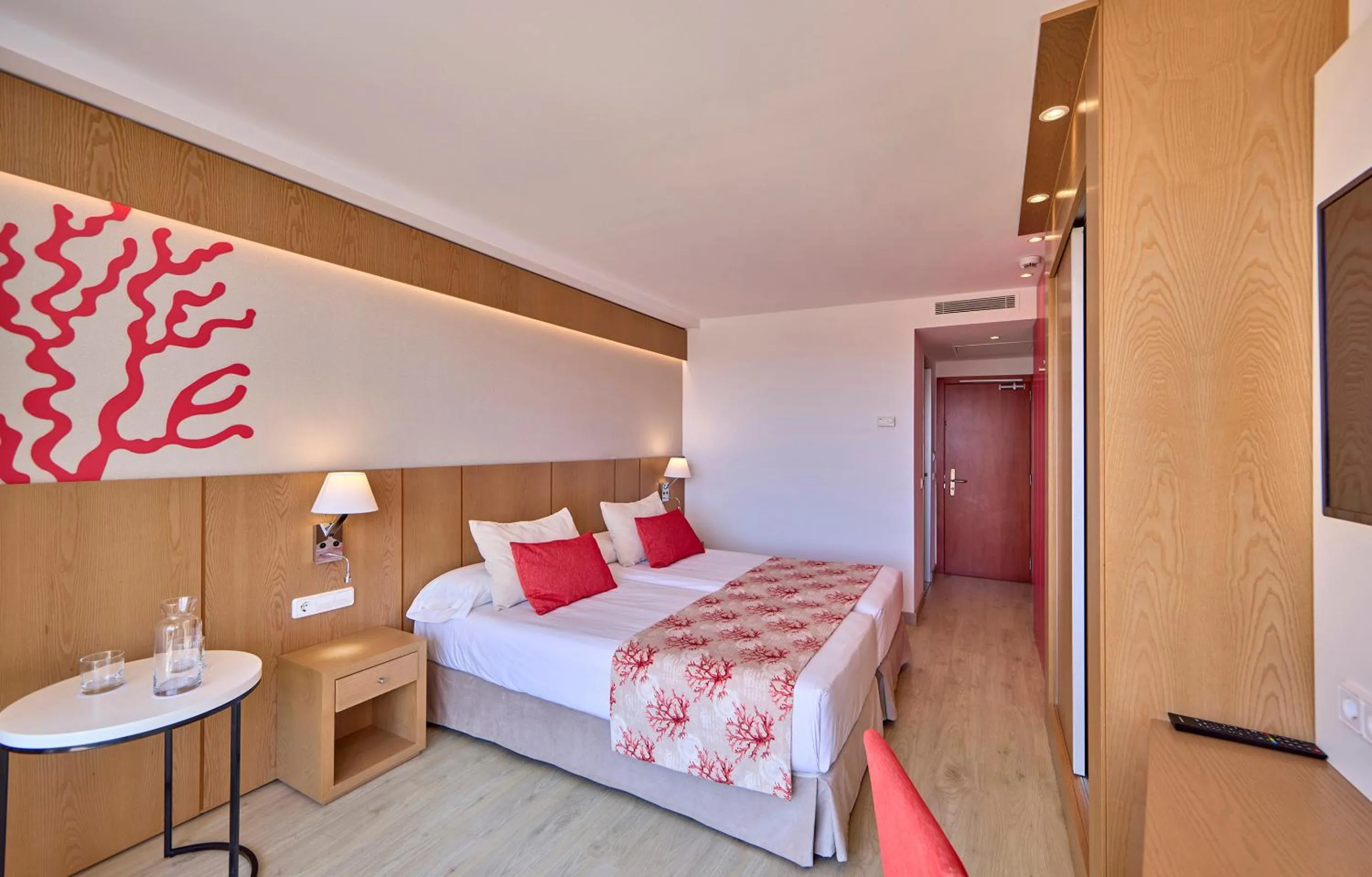 Bed in Universal Hotel Perla