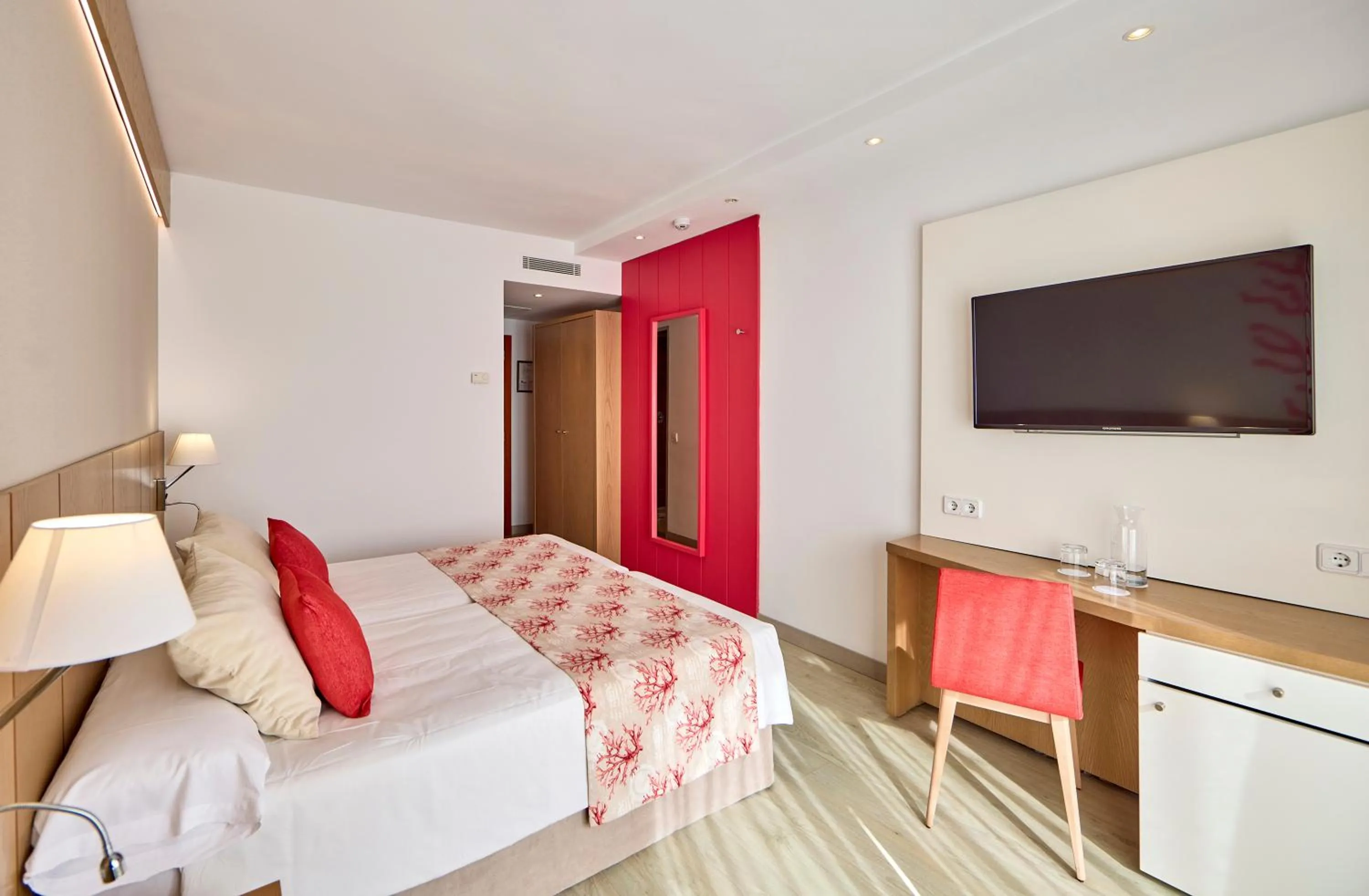 Bed in Universal Hotel Perla