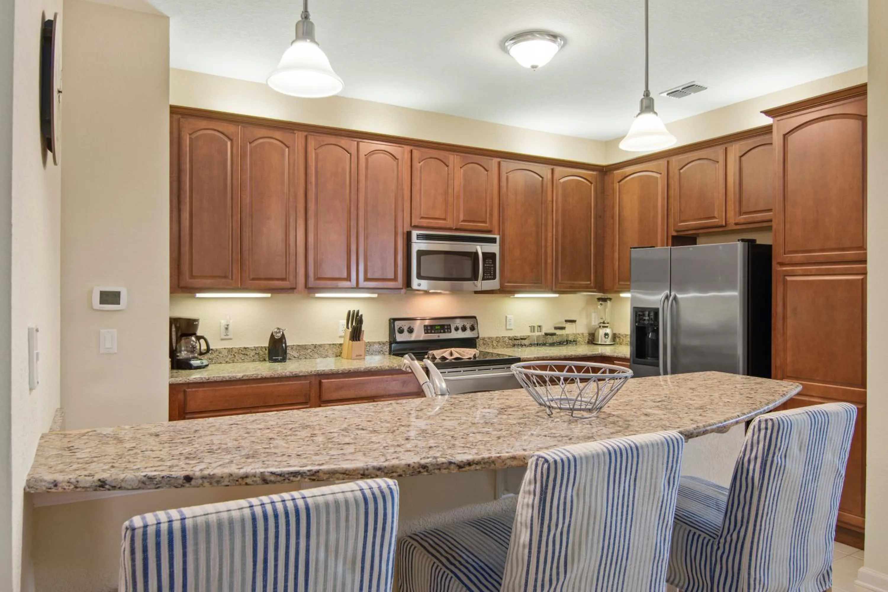 Kitchen or kitchenette in Orlando Resort Rentals at Universal Boulevard