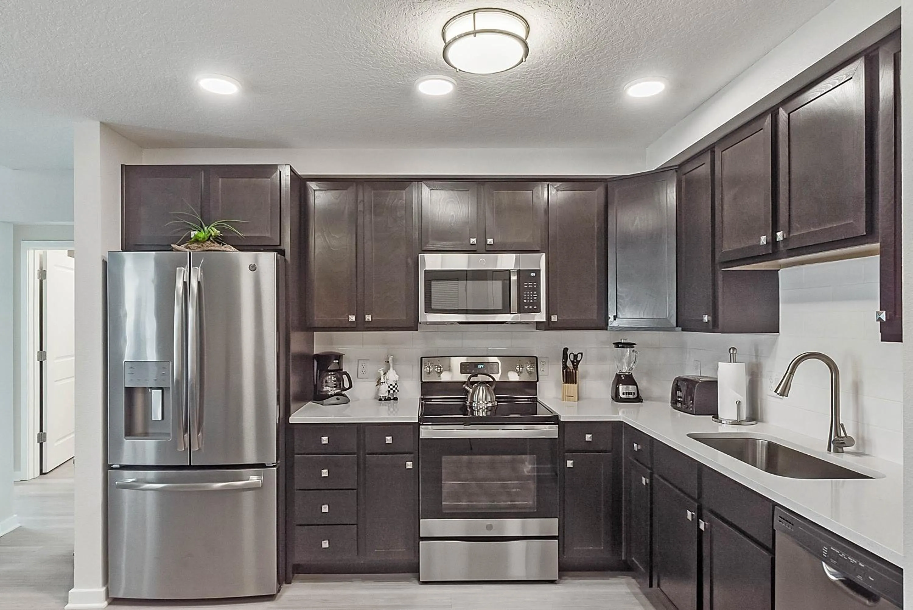 Kitchen or kitchenette in Orlando Resort Rentals at Universal Boulevard
