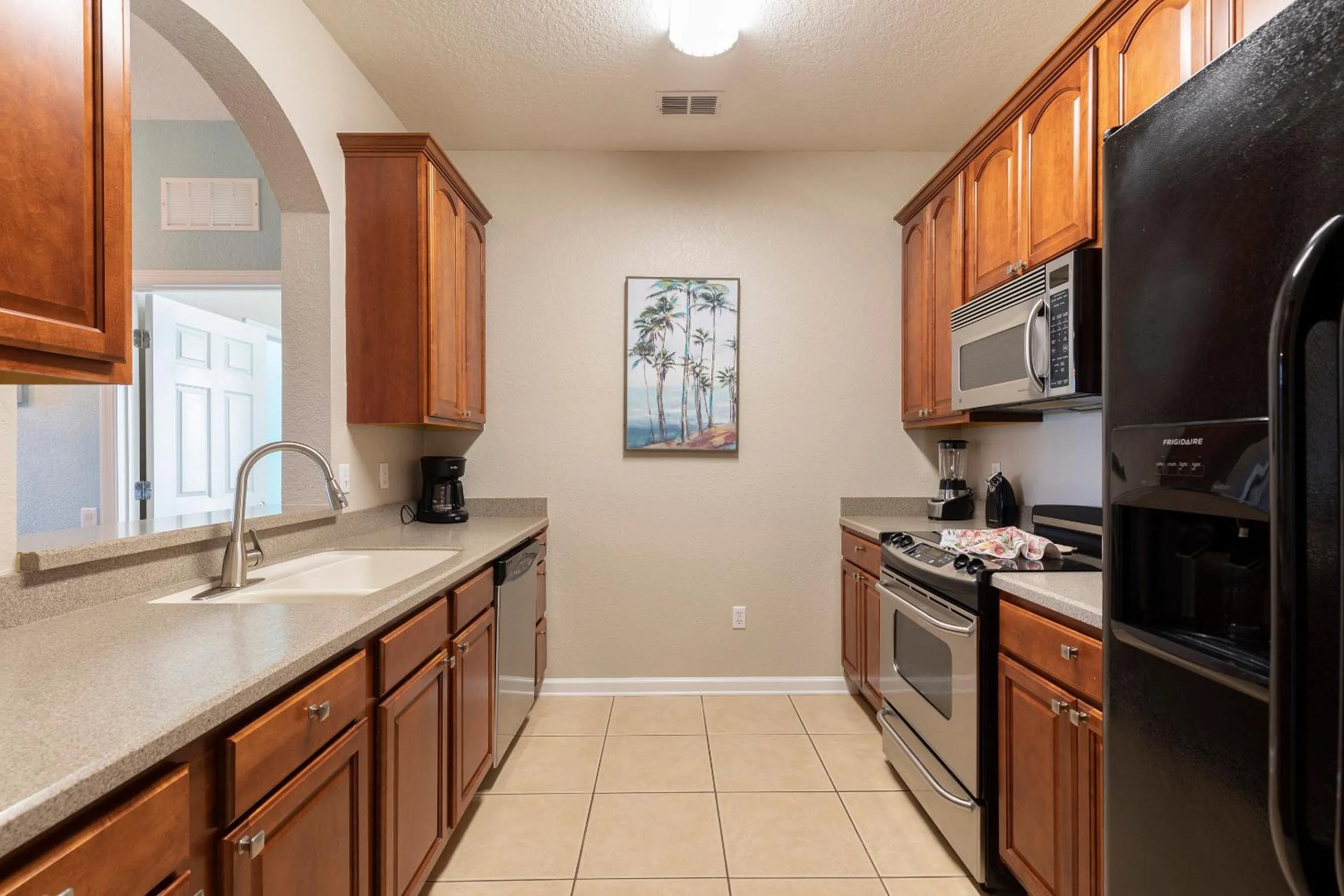 Kitchen or kitchenette in Orlando Resort Rentals at Universal Boulevard