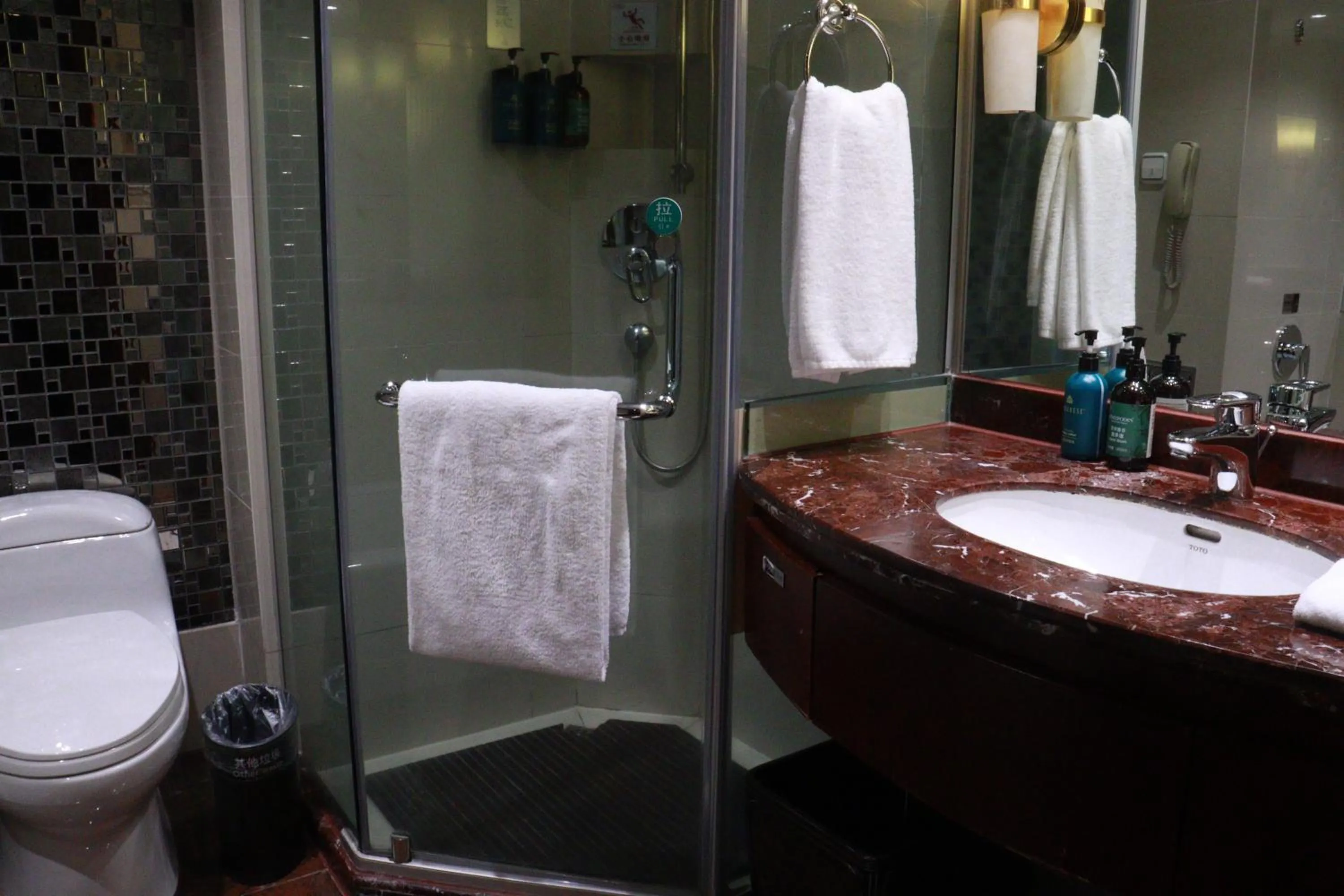 Shower in Crowne Plaza City Center Ningbo by IHG