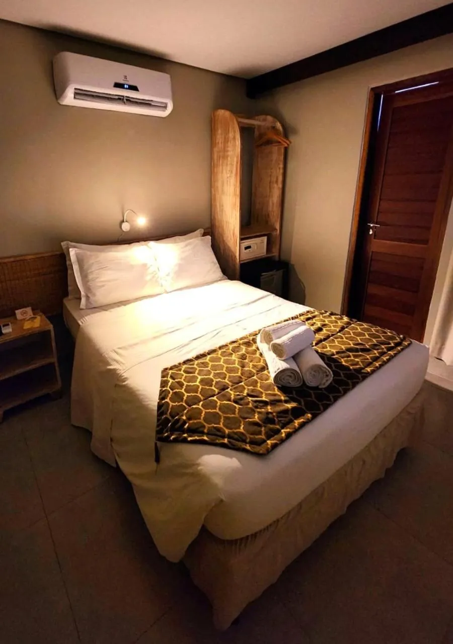 Bed in Pousada Recanto