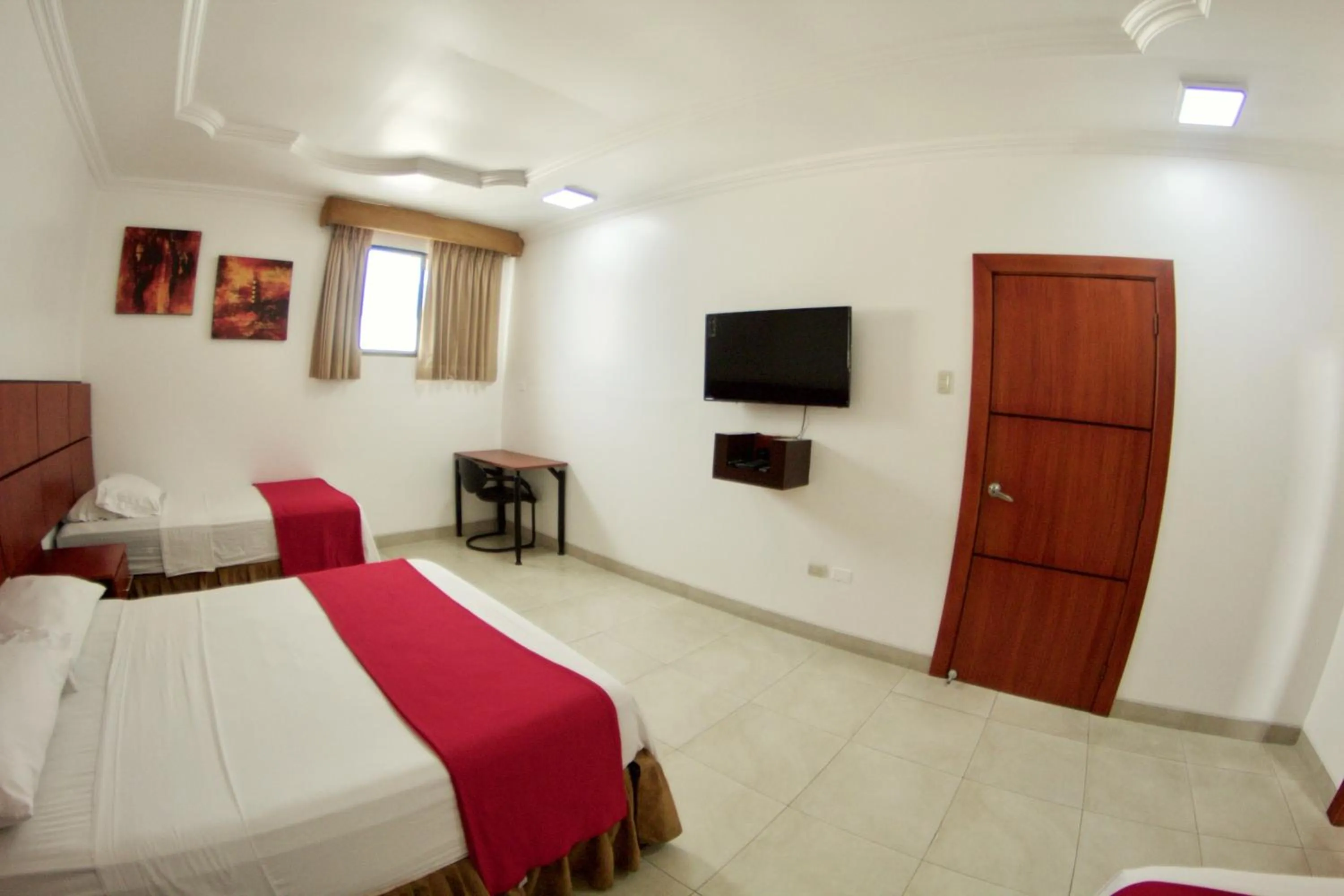 Photo of the whole room, Bed in Hoteles en Guayaquil - Suites Guayaquil Cerca del Aeropuerto