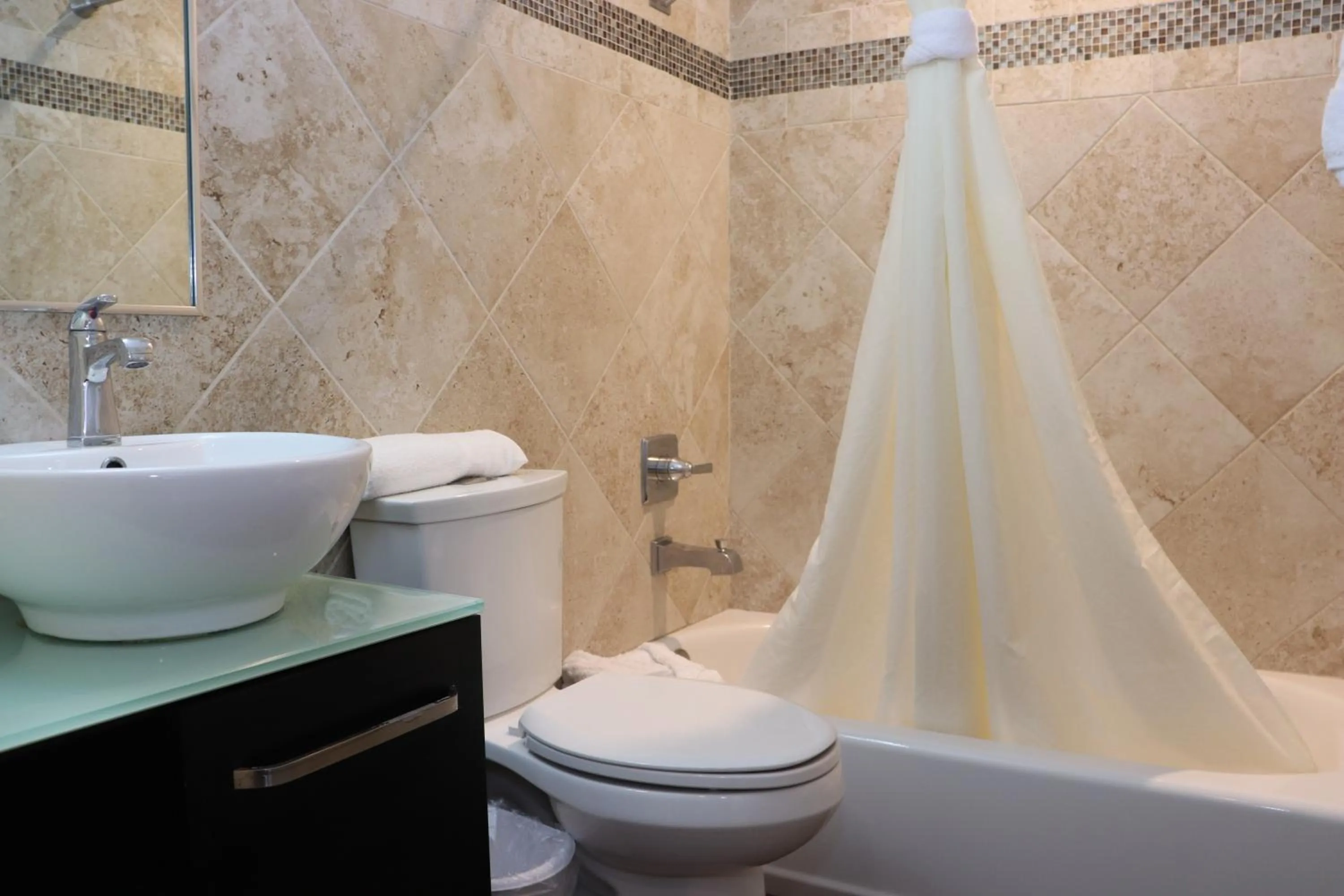 Shower in Curtis Inn & Suites