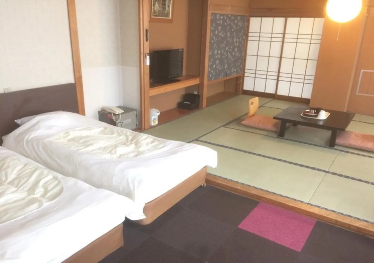 Bed in Higashiyama Park Hotel Shinfugetsu