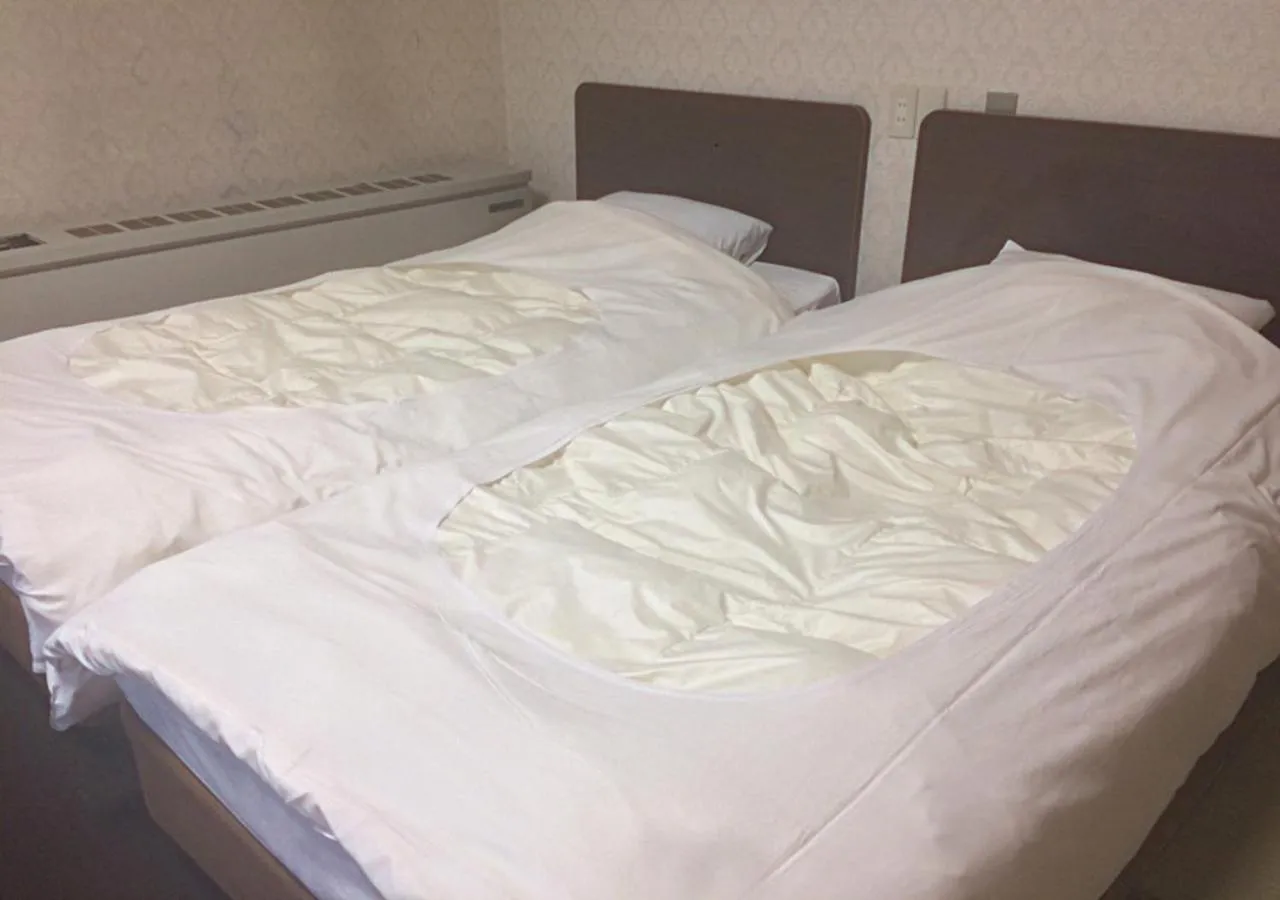 Bed in Higashiyama Park Hotel Shinfugetsu